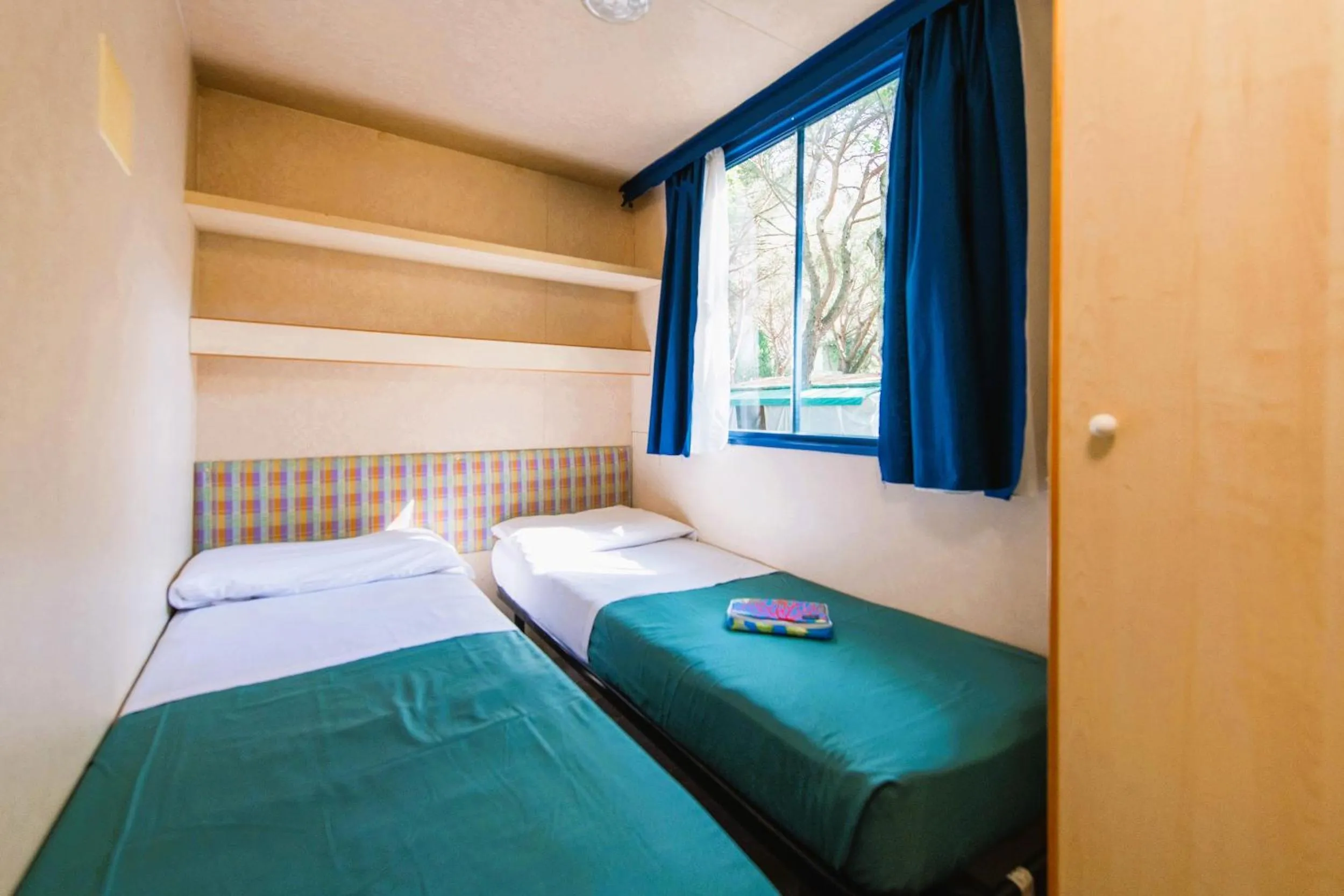 Bed in Camping Village Punta Navaccia