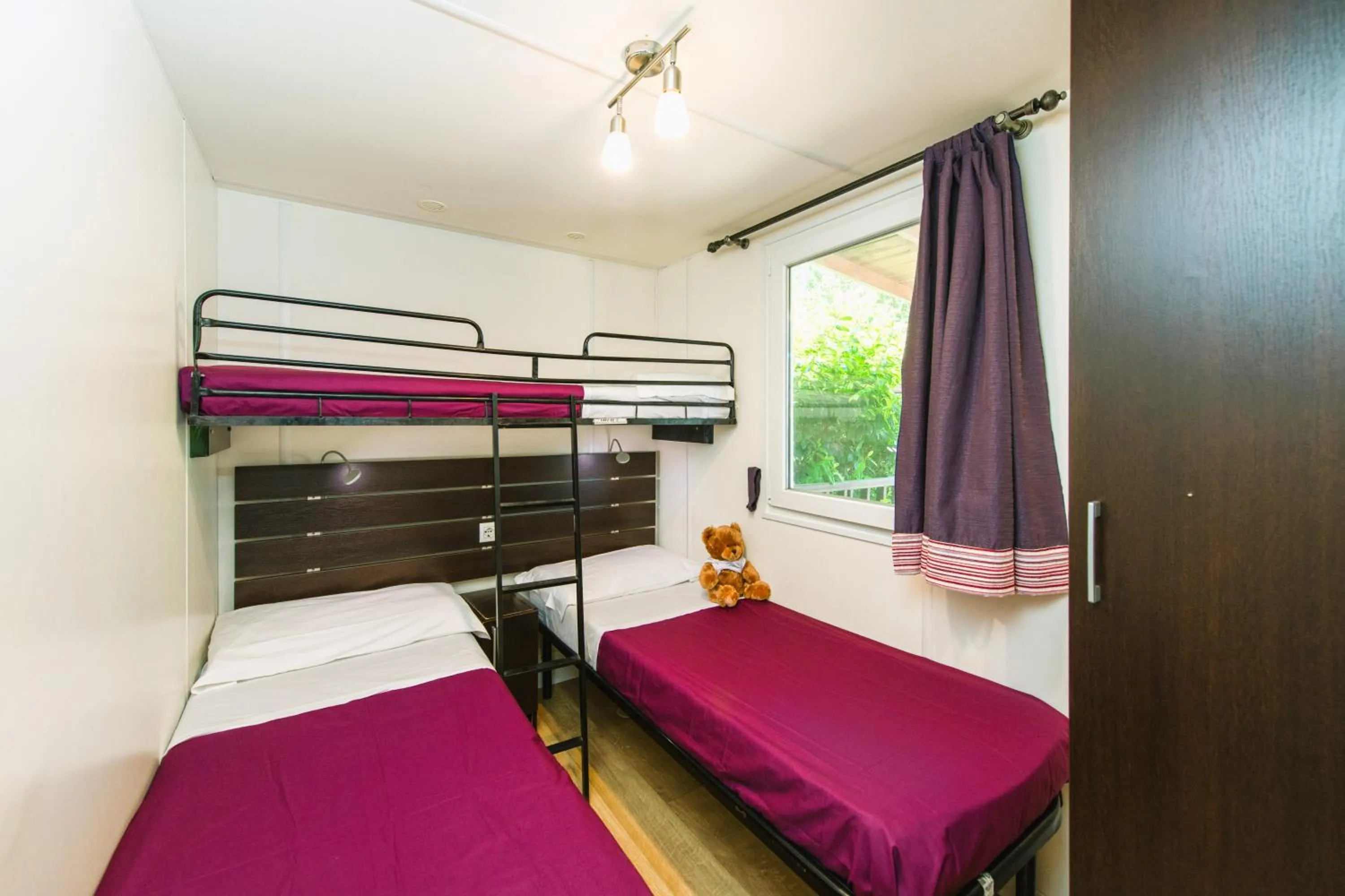 Bed in Camping Village Punta Navaccia