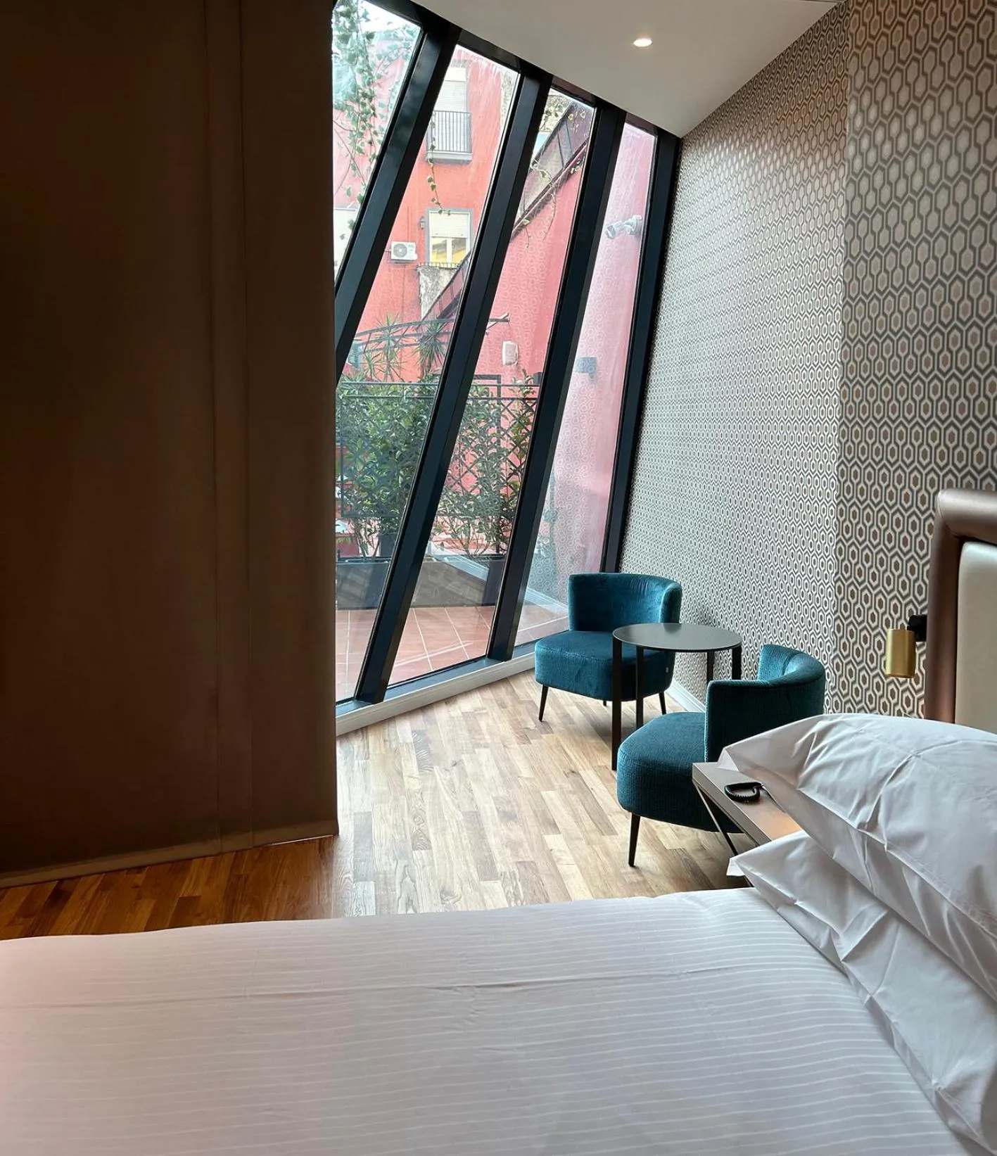 Living room, Bed in Caruso Place Luxury Rooms & Suites