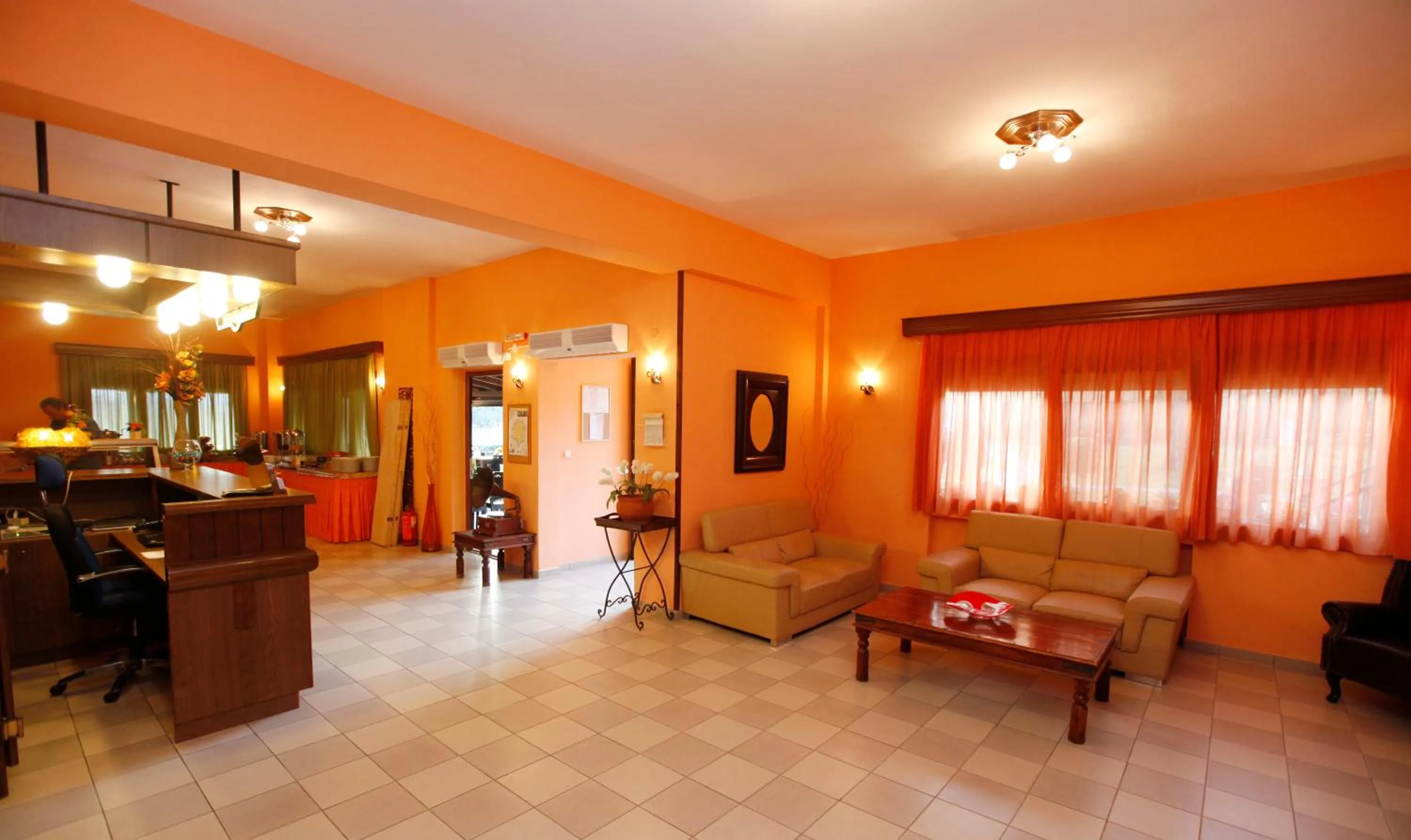 Communal lounge/ TV room in Ariadni Hotel Bungalows