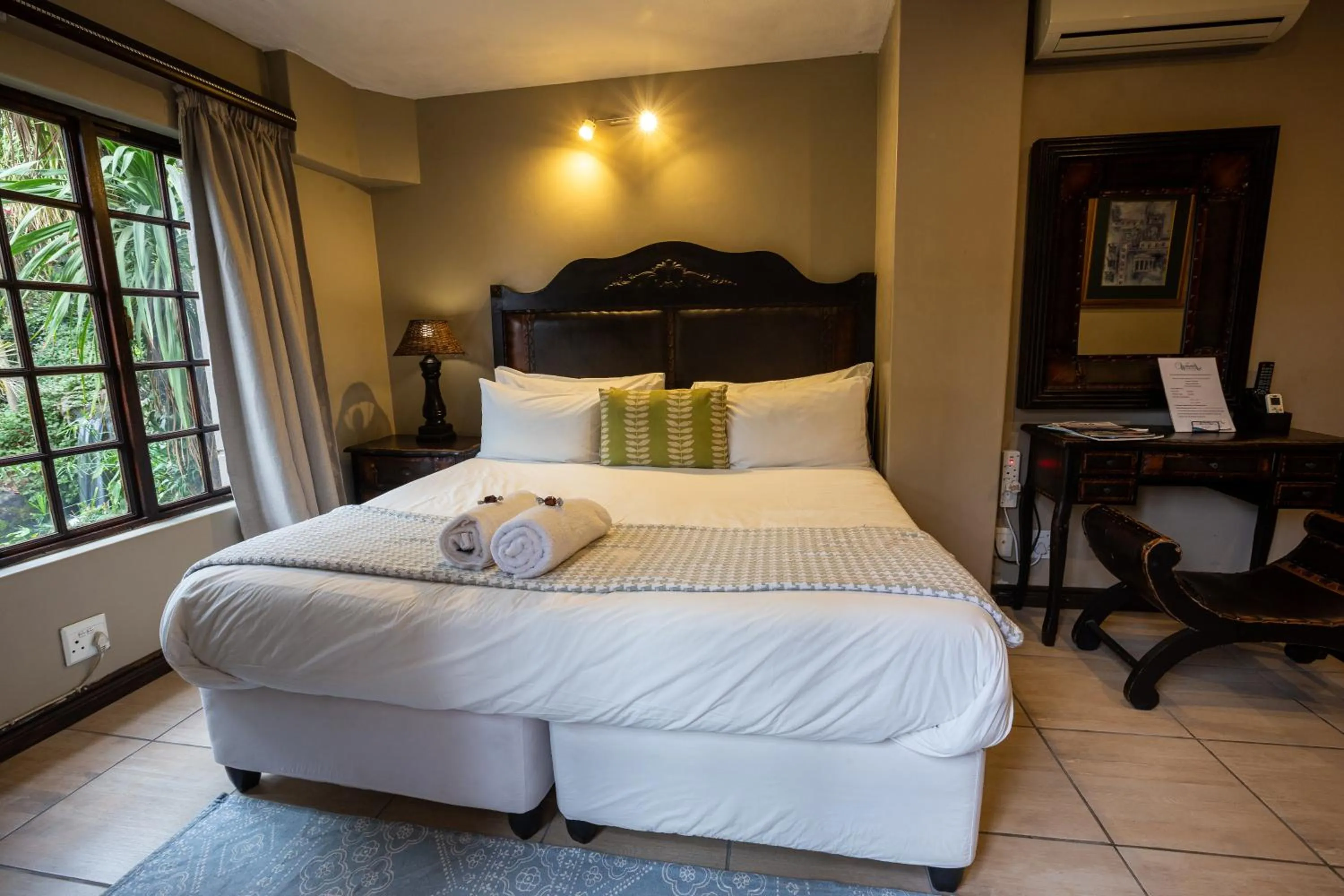 Bed in Waterfalls Boutique Hotel