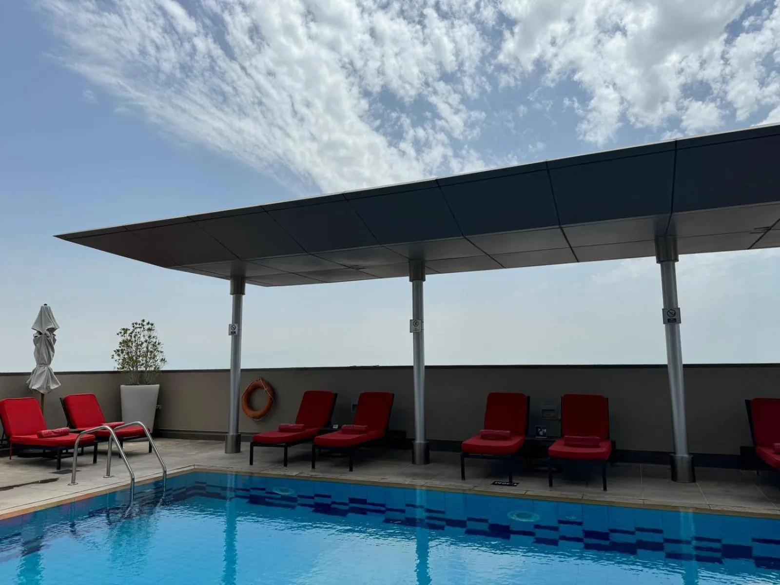 Swimming pool in Centro Al Manhal by Rotana