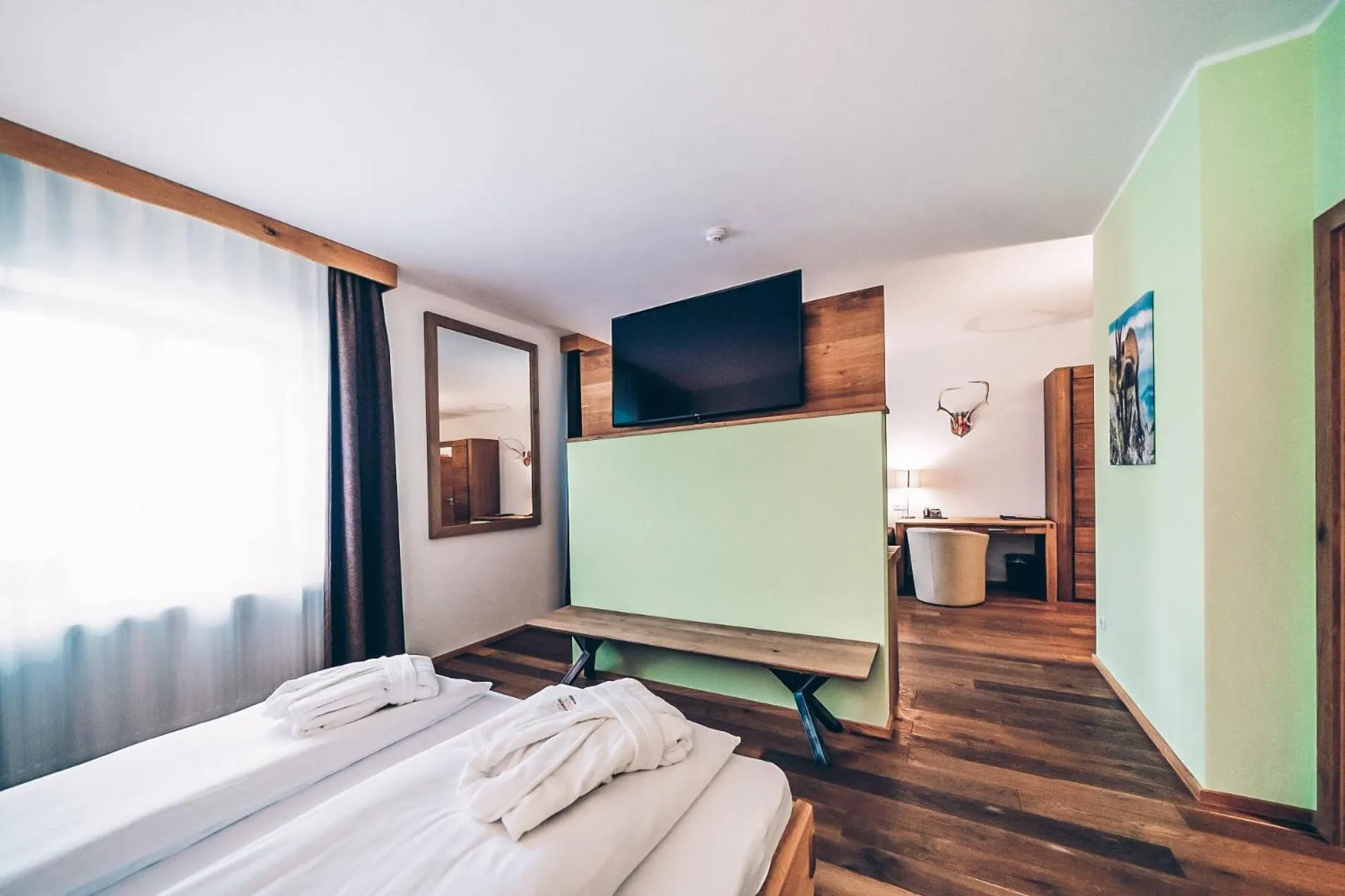 Communal lounge/ TV room, Bed in Aktivhotel Wildschütz