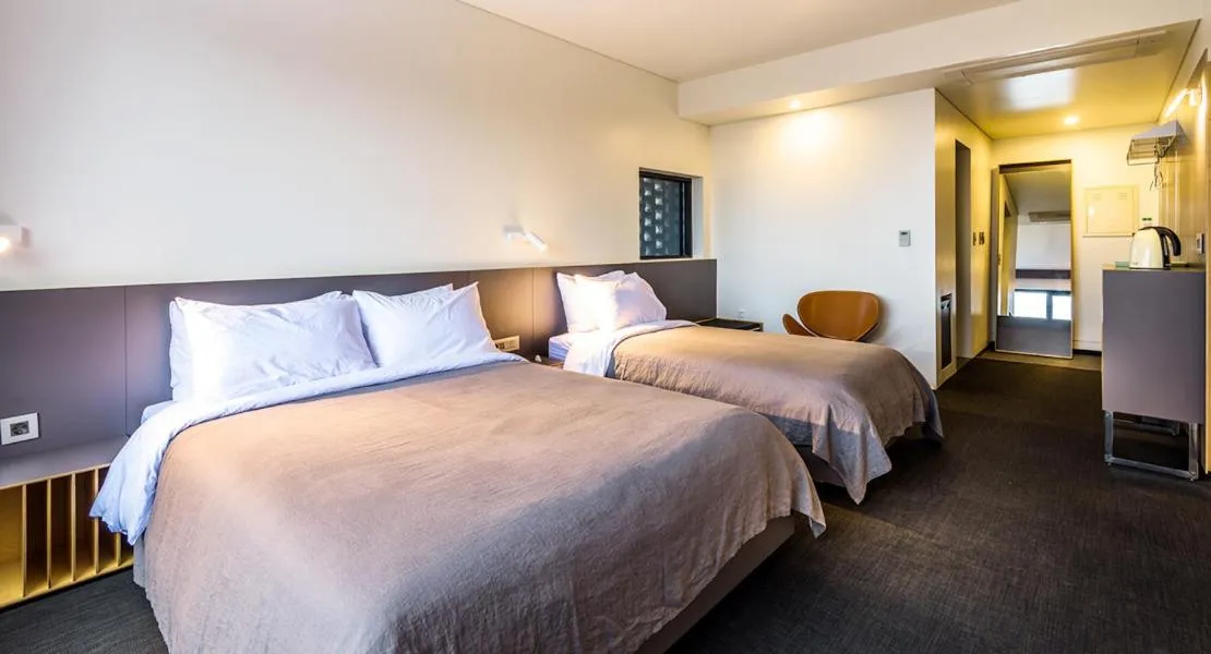 Bed in Jeju Bricks Hotel