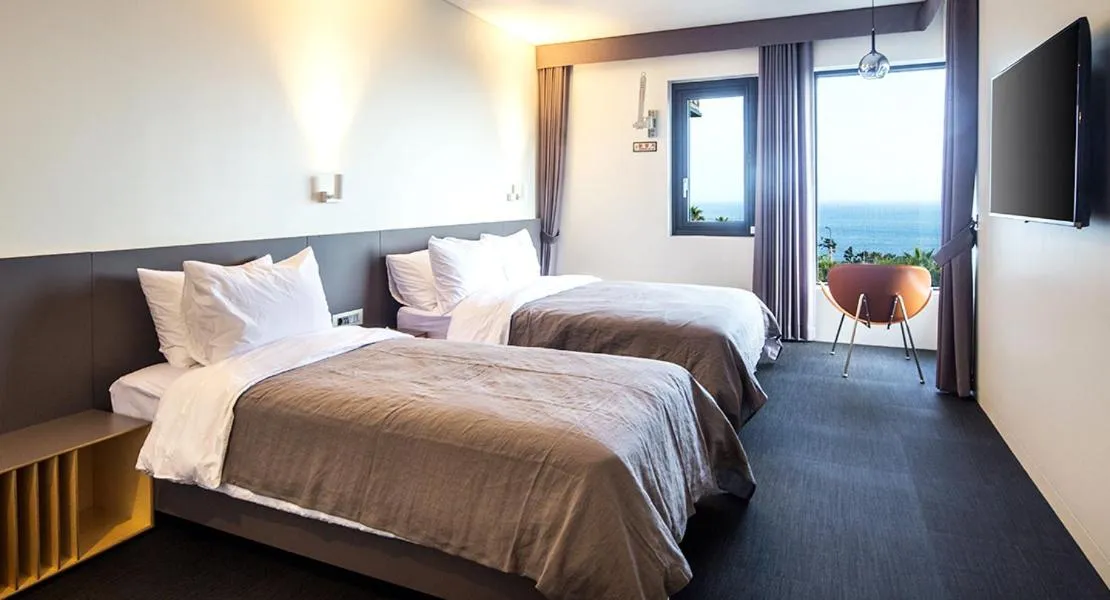 Bed in Jeju Bricks Hotel