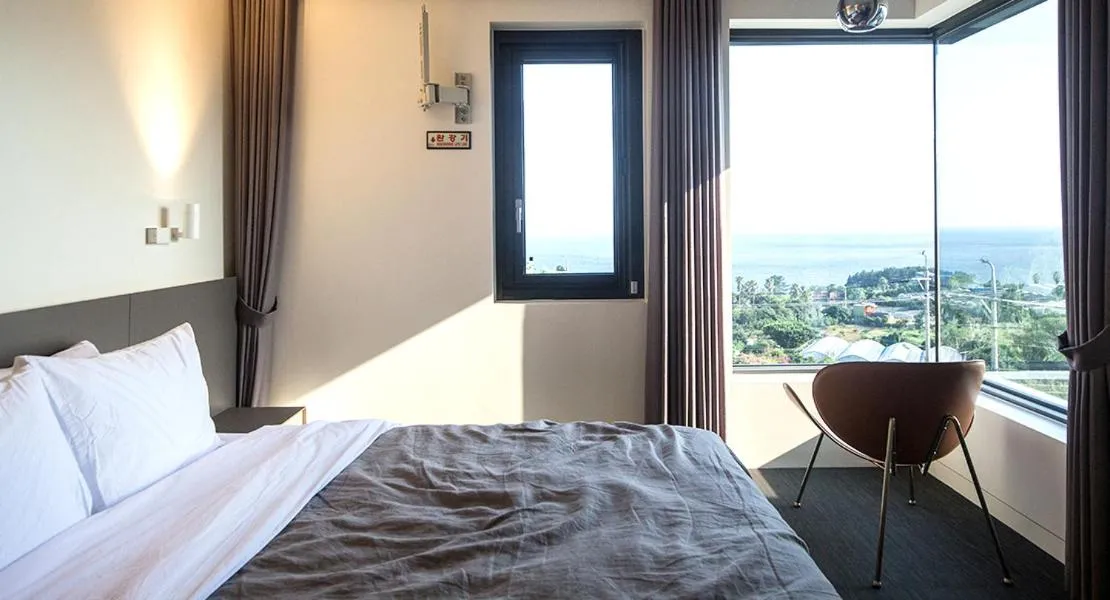 Bed in Jeju Bricks Hotel