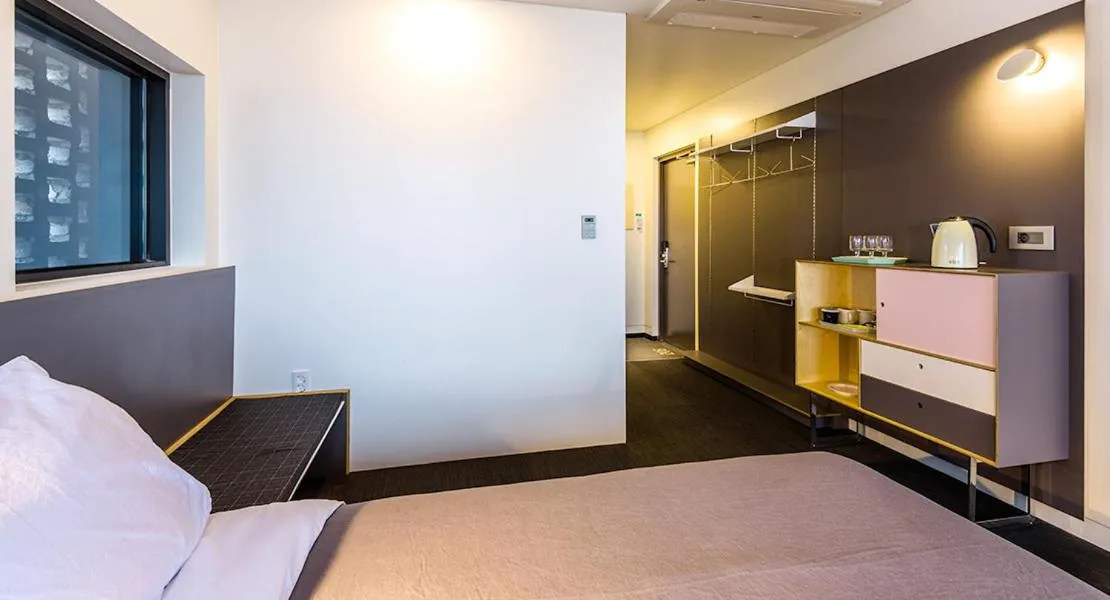 Bed in Jeju Bricks Hotel