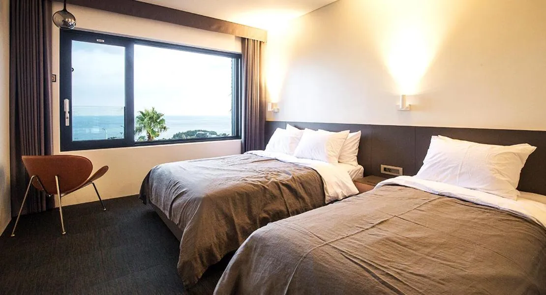 Bed in Jeju Bricks Hotel