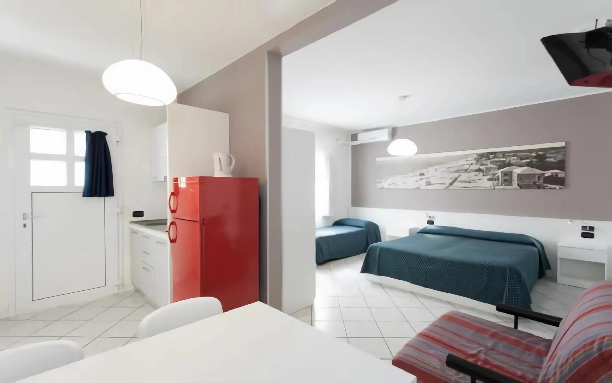 Kitchen or kitchenette, Bed in Hotel & Residence Progresso