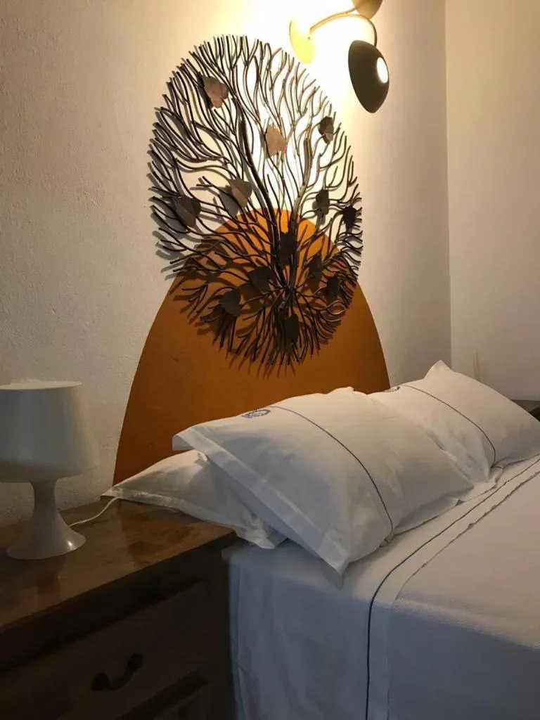 Bed in Recanto das Andorinhas Studios