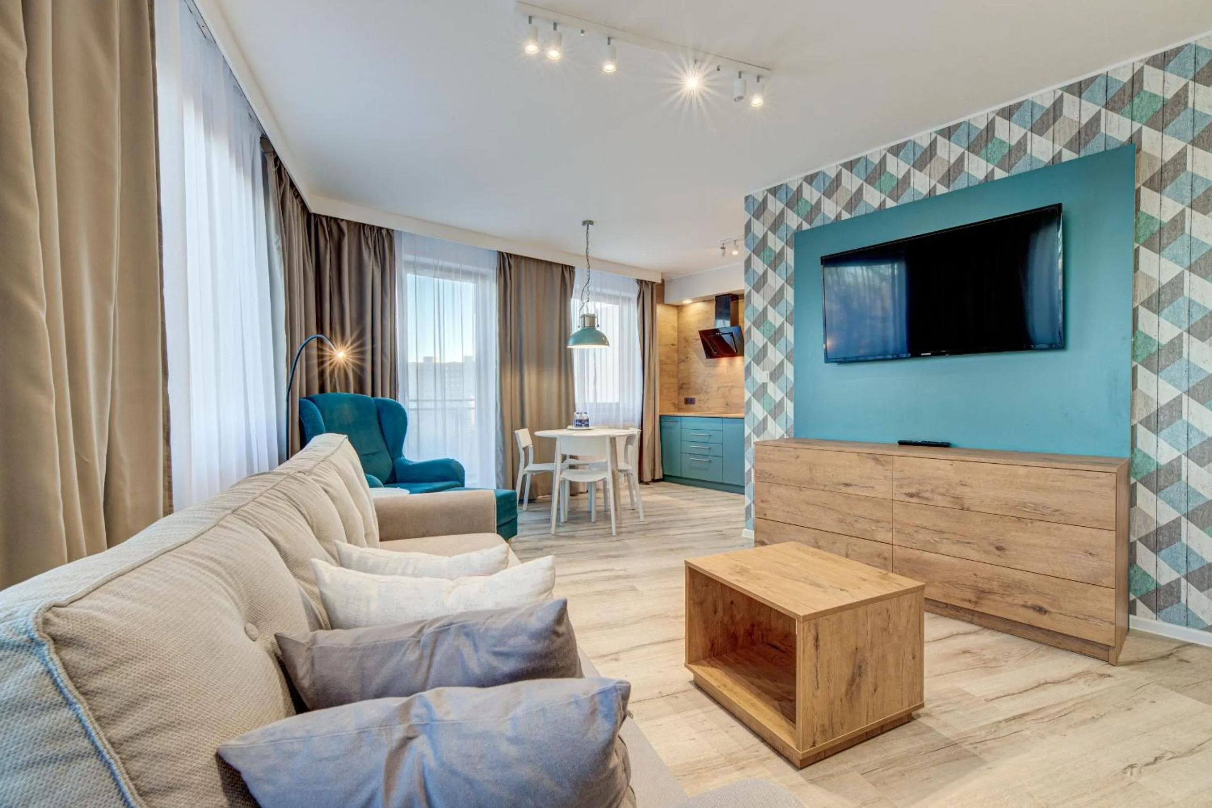 Communal lounge/ TV room in Apartamenty Rondo