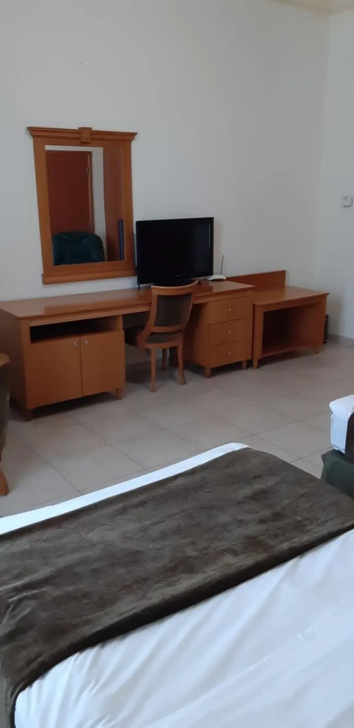 Bed in Platinum Hotel Apartments