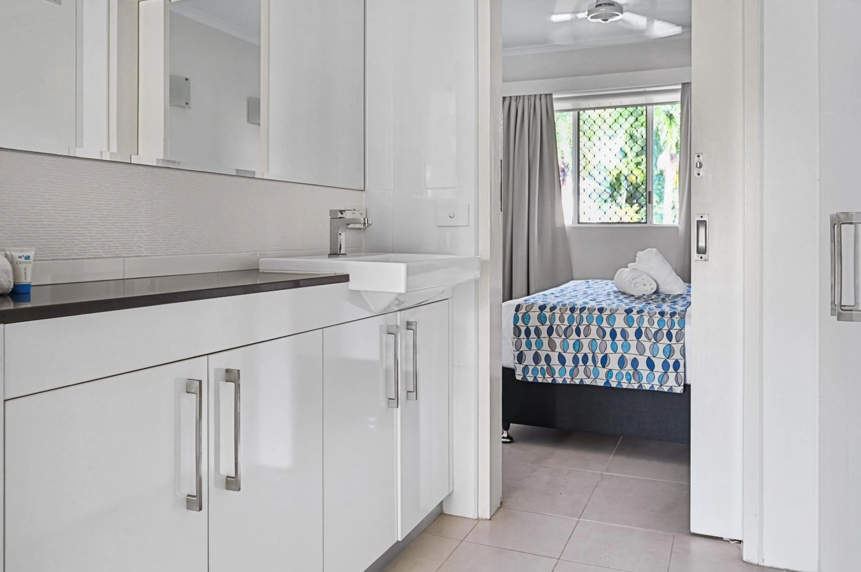 Bed in Marlin Waters Beachfront Apartments