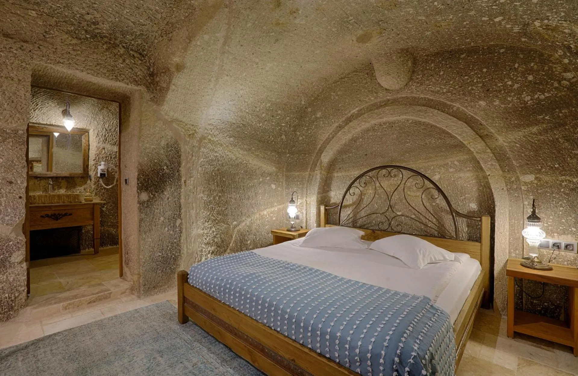 Bed in Hera Cave Suites