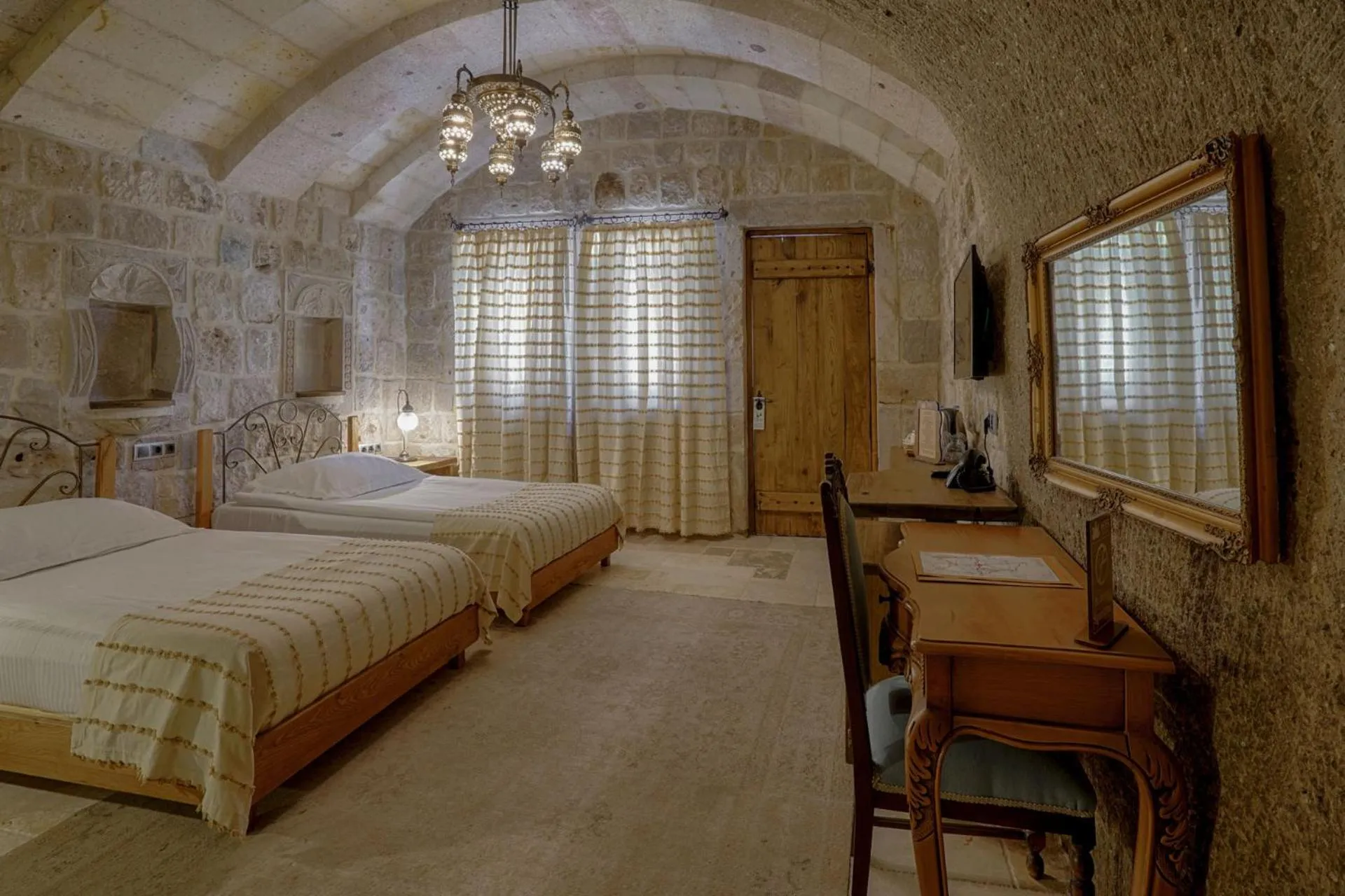 Bed in Hera Cave Suites