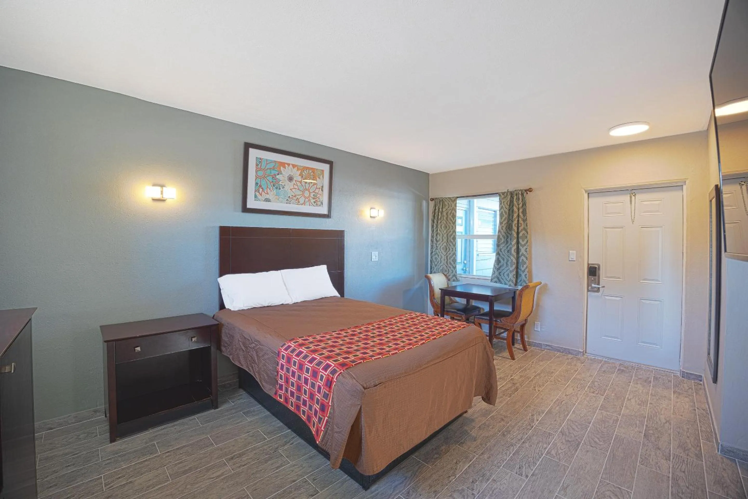 Bedroom, Bed in Sunrise Inn by OYO Titusville FL