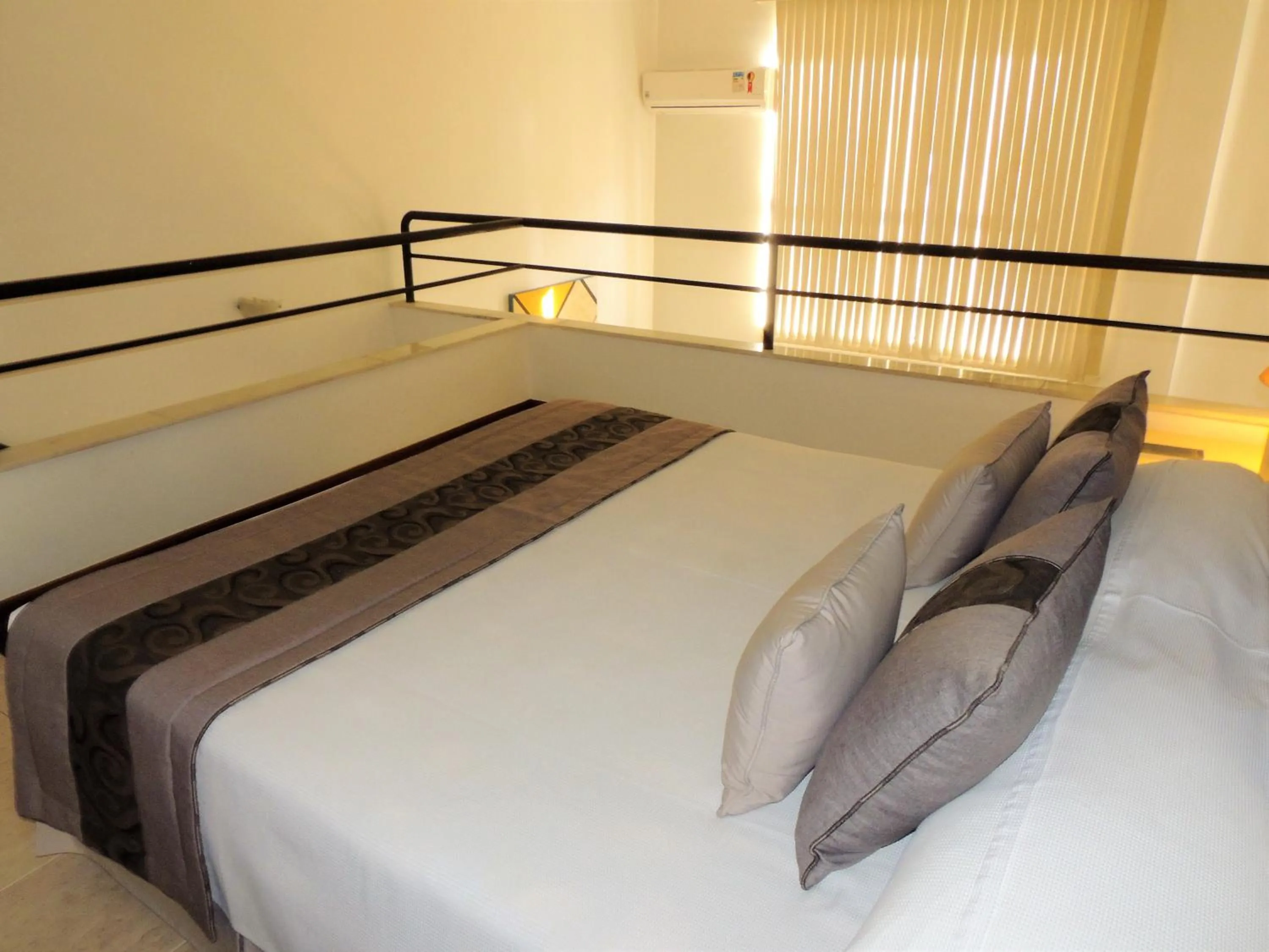 Bed in Mondrian Suite Hotel