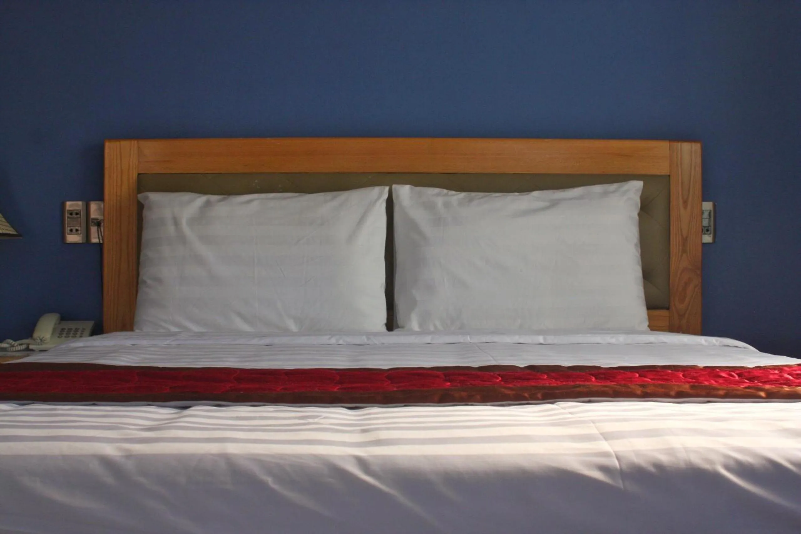 Bed in Marigold Hotel & Apartment