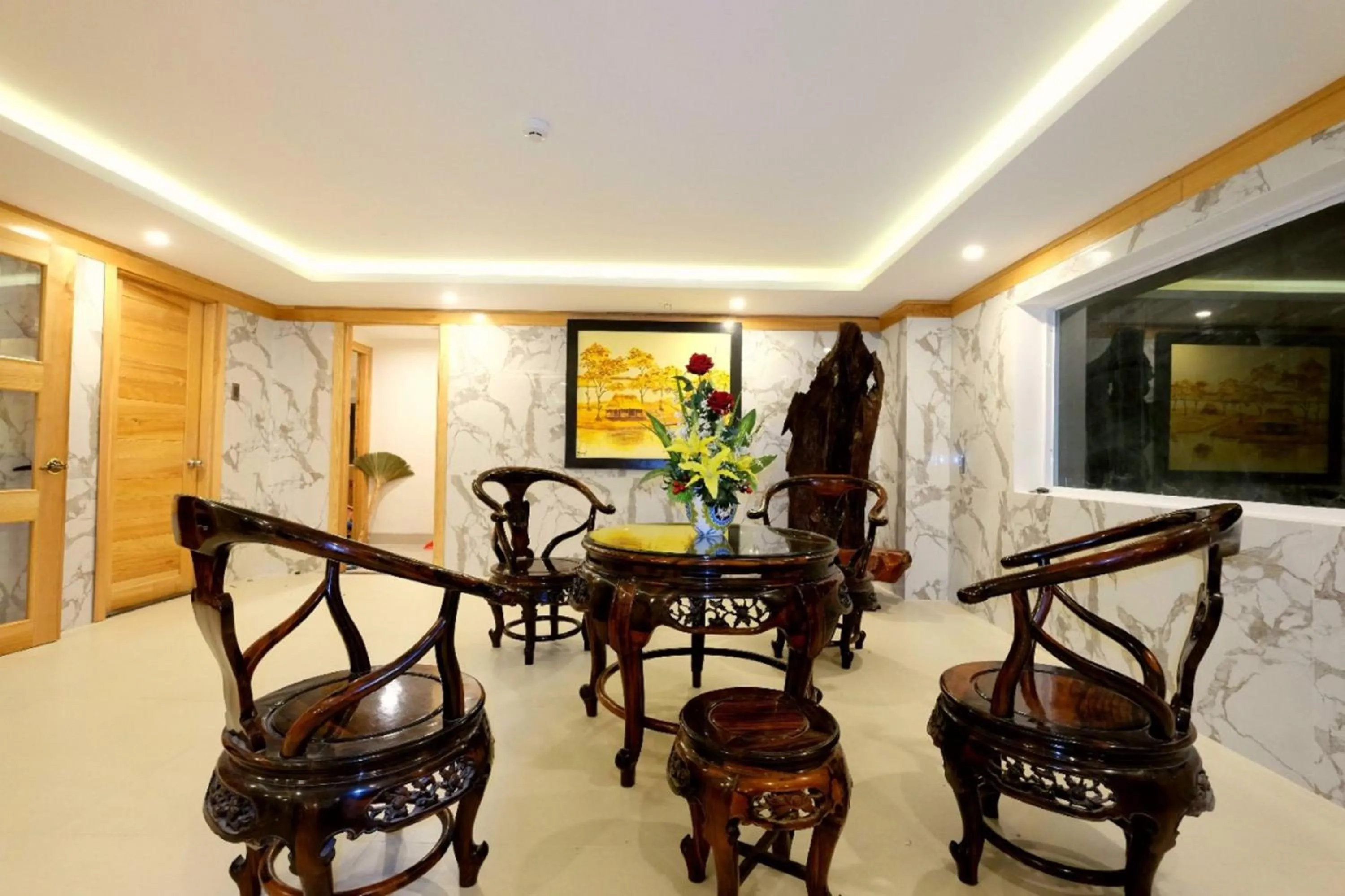 Seating area in Marigold Hotel & Apartment