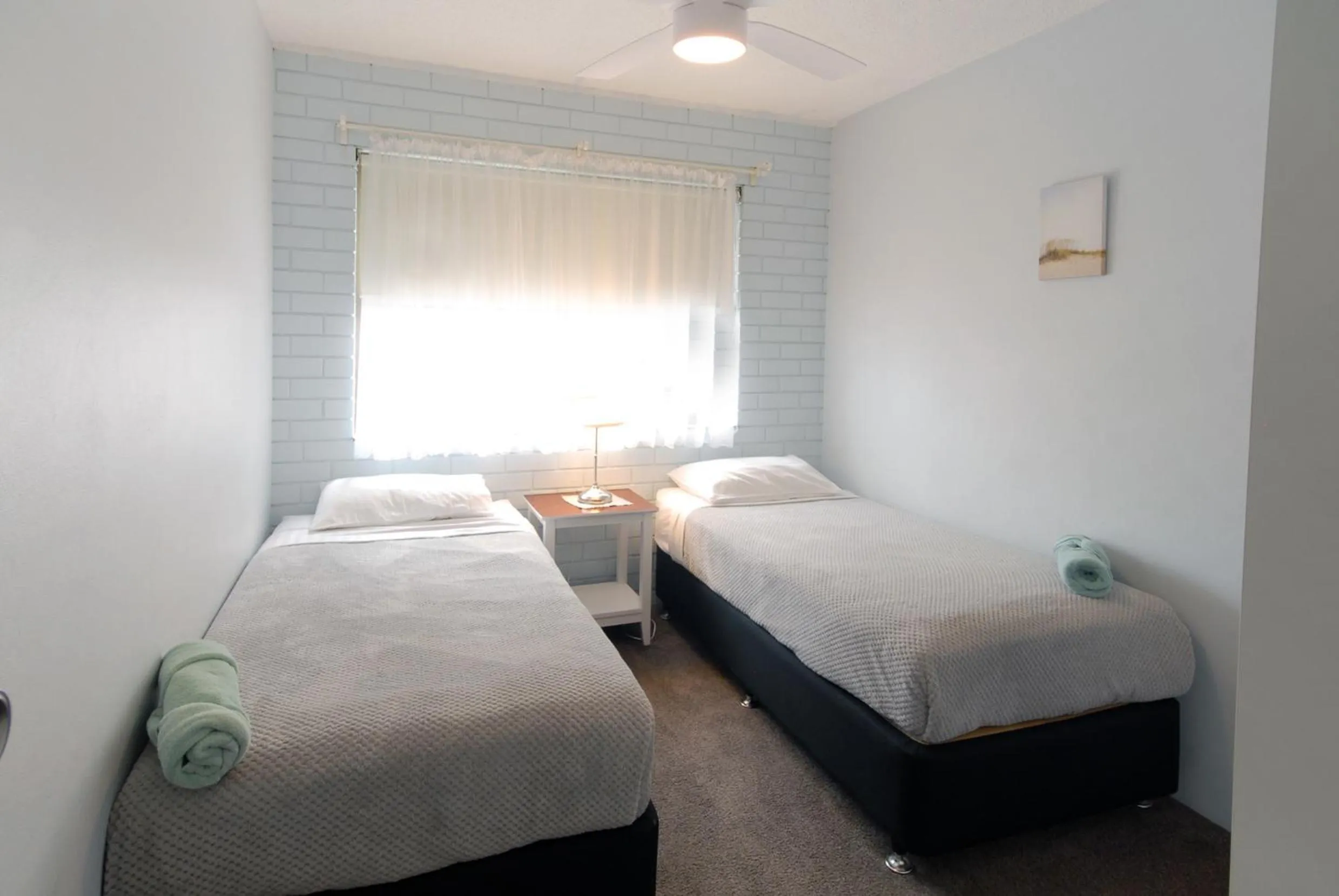 Bed in Marcel Towers Holiday Apartments