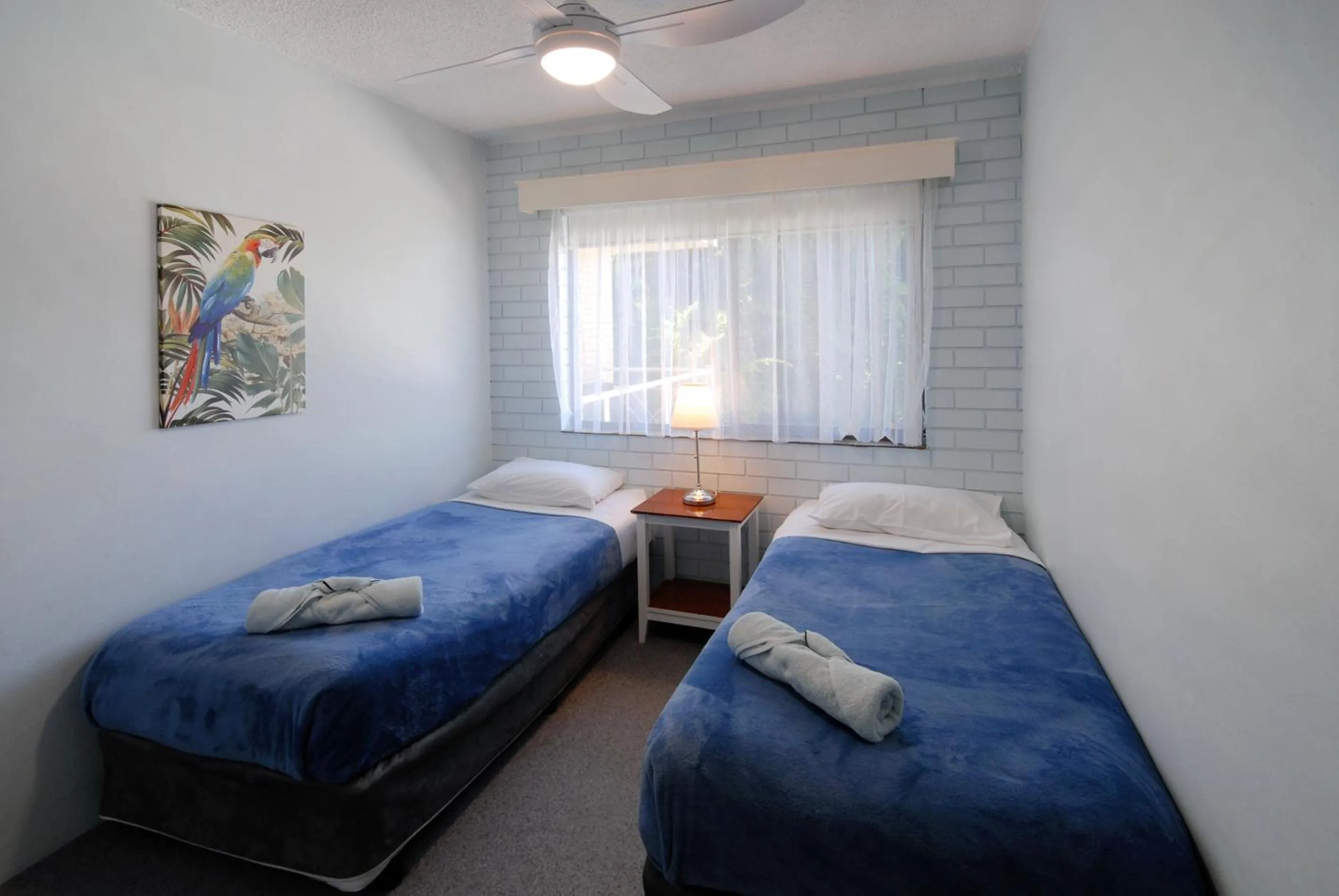 Bed in Marcel Towers Holiday Apartments