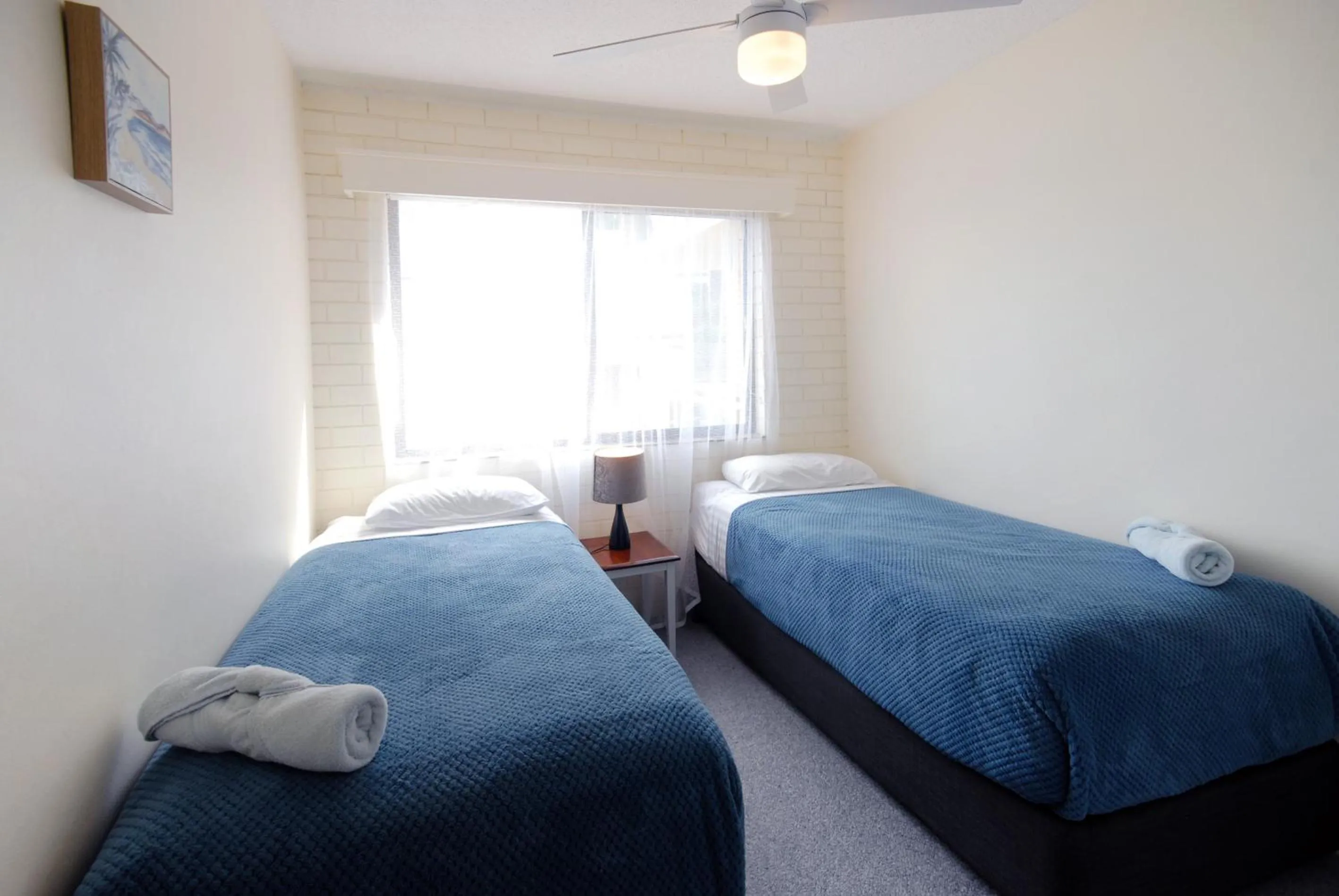 Bed in Marcel Towers Holiday Apartments