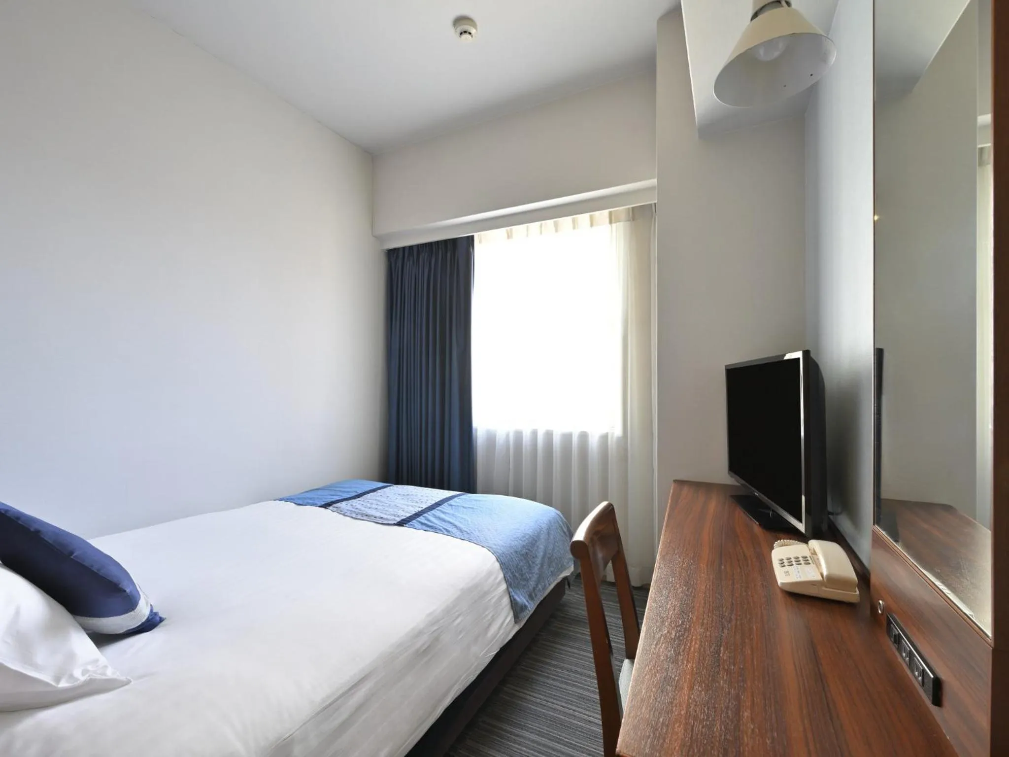 Bed in Rihga Hotel Zest Takamatsu