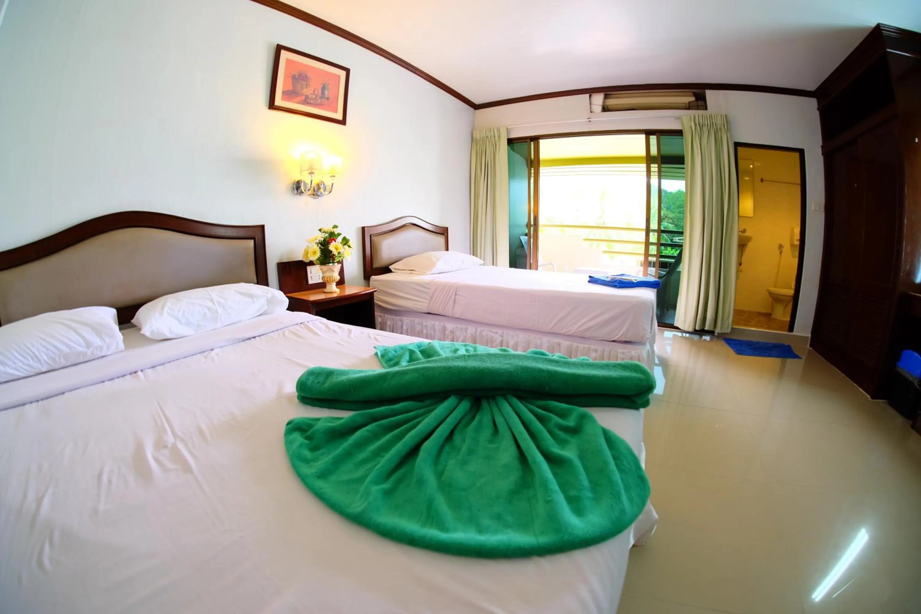 Bathroom, Bed in P.K. Mansion