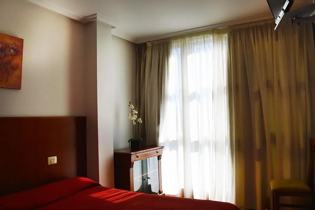 Bed in Hotel Os Caracoles