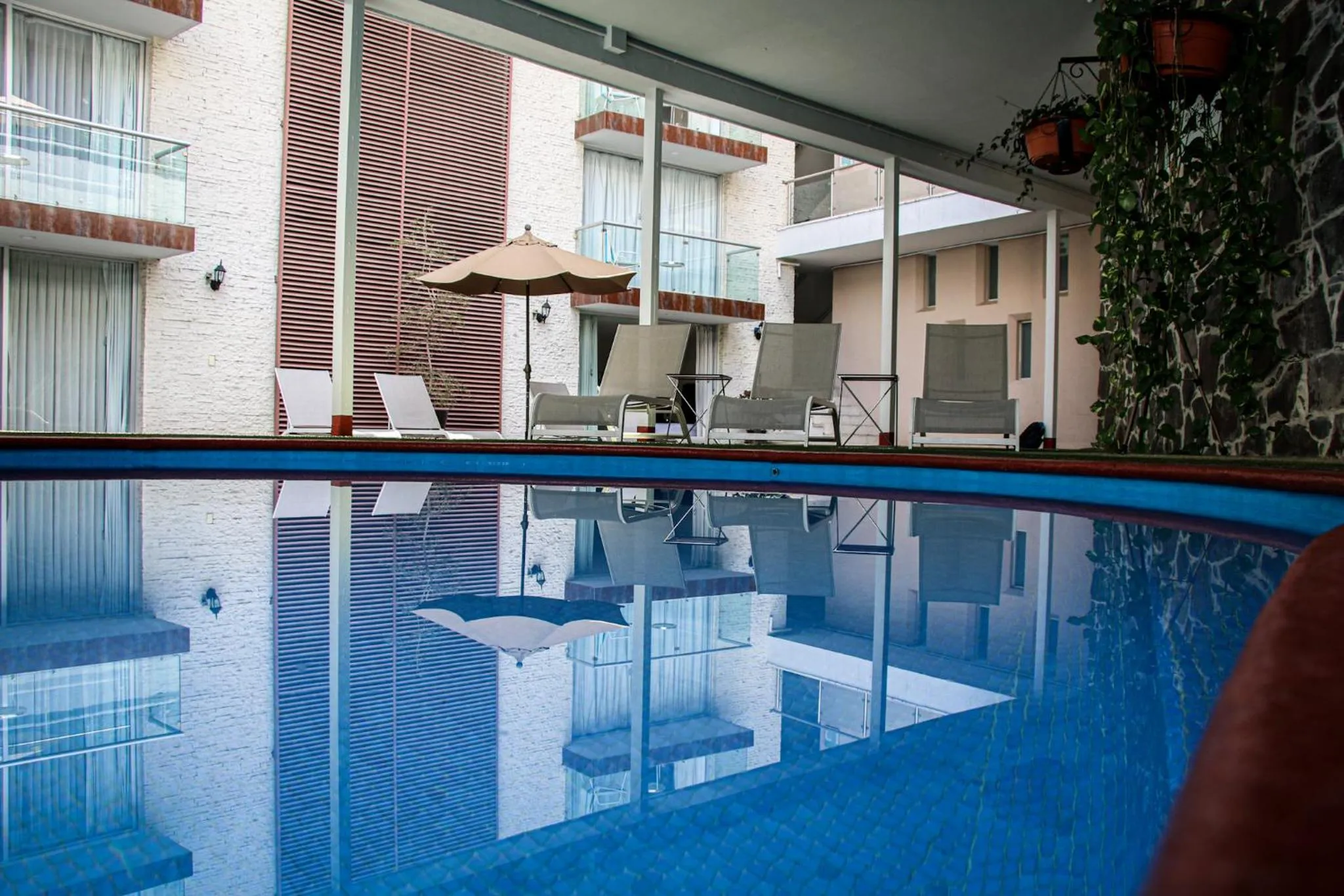Swimming pool in Country Hotel & Suites