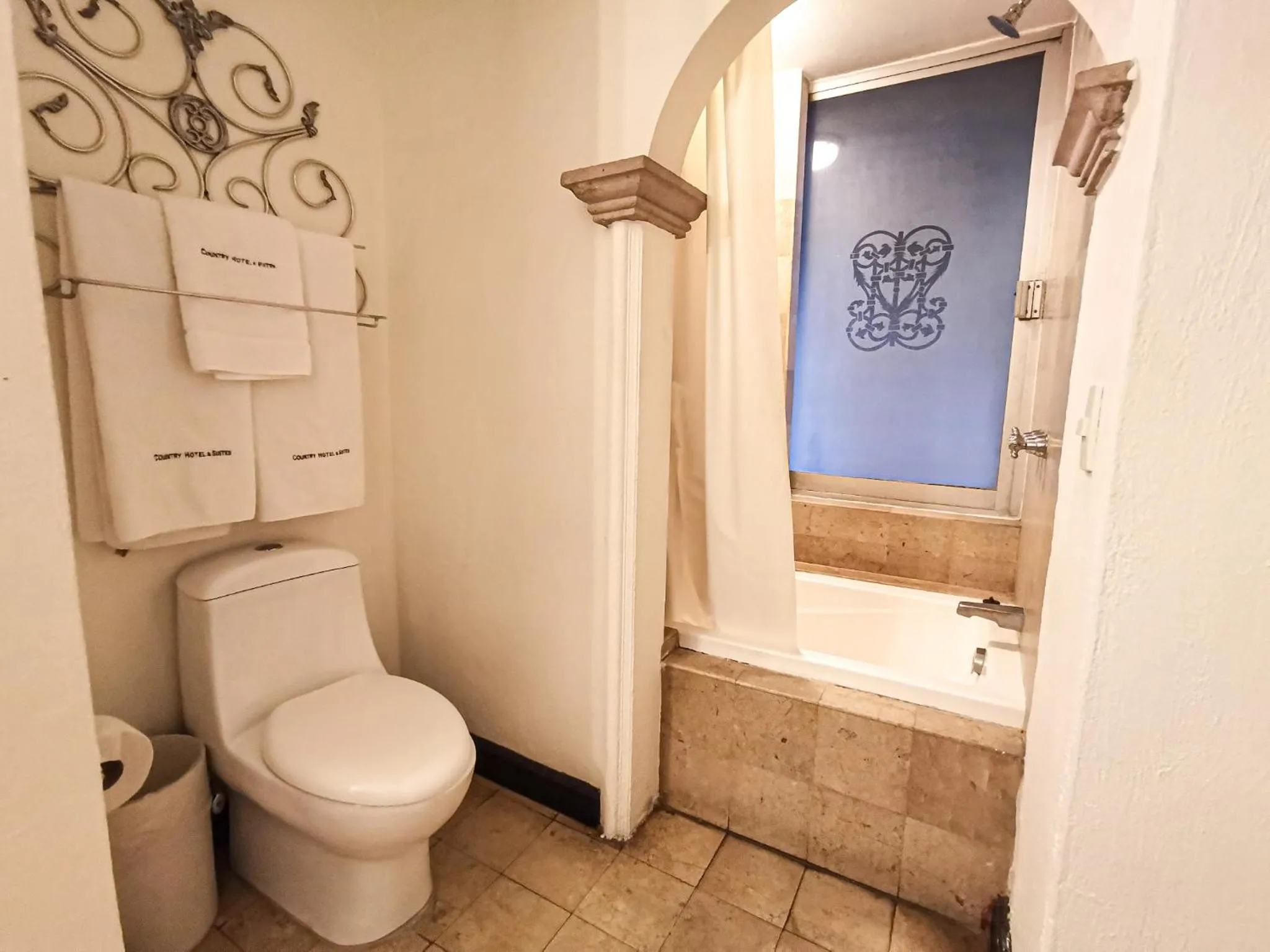 Bathroom in Country Hotel & Suites