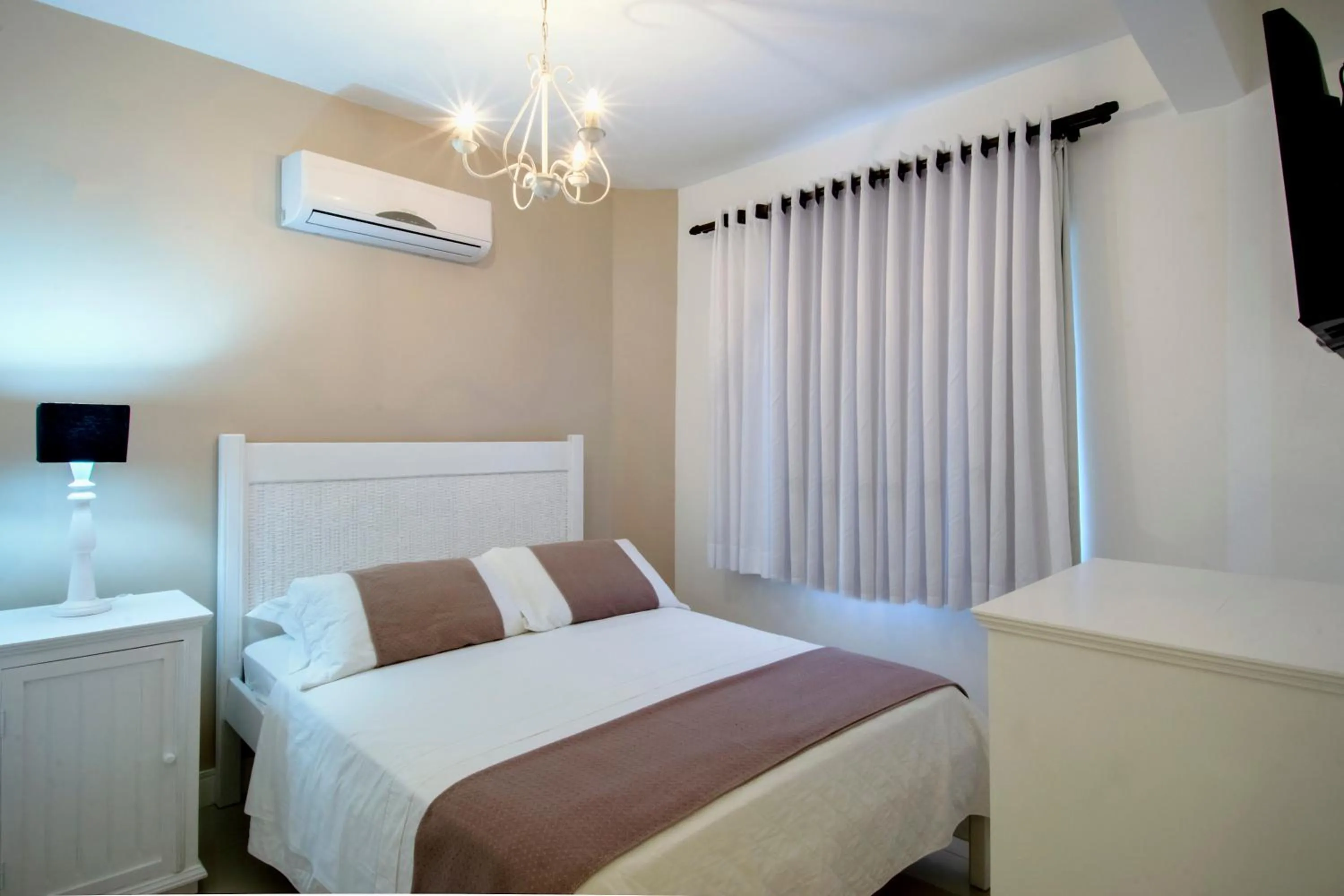 Bed in Pousada Bora Bora