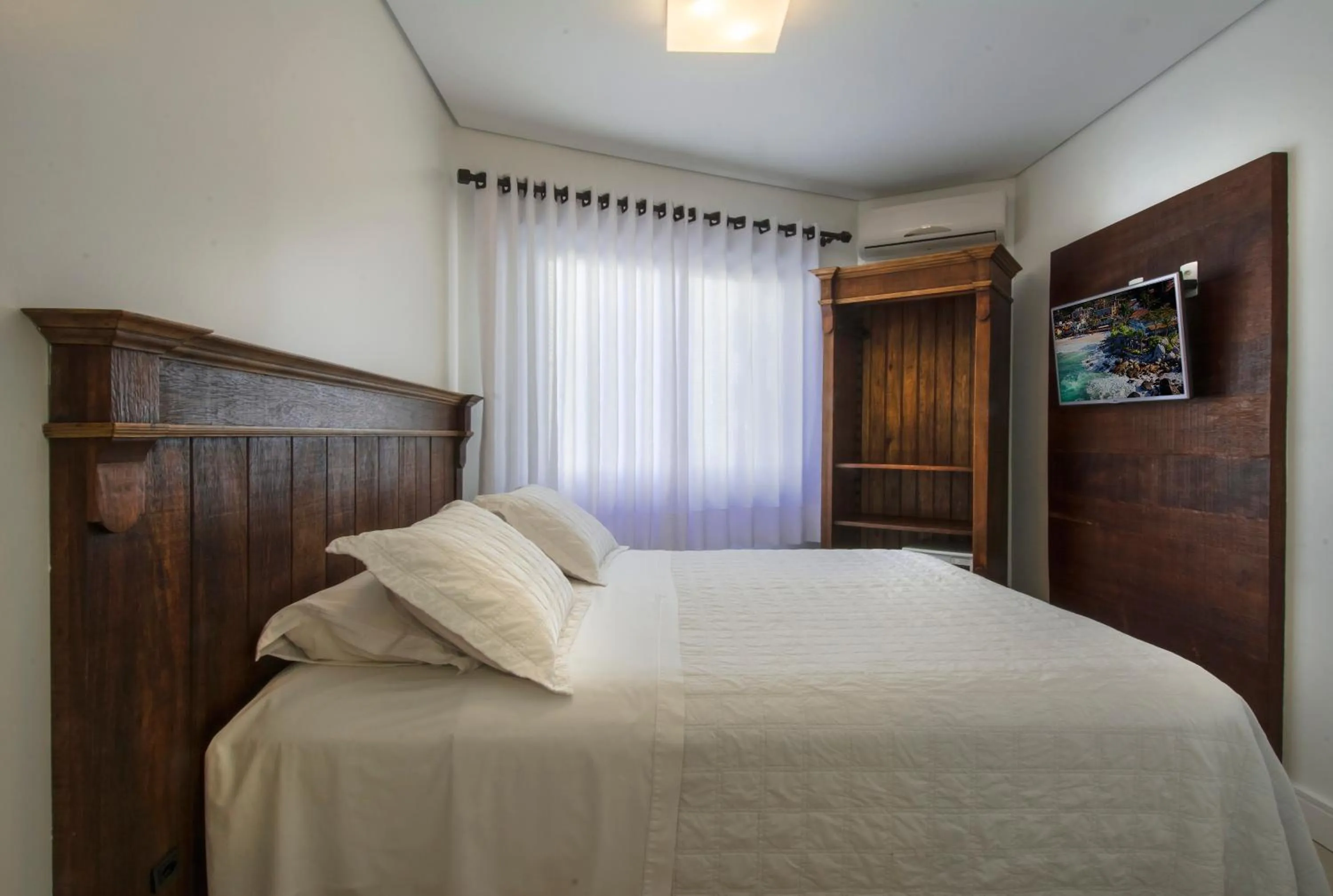 Bed in Pousada Bora Bora