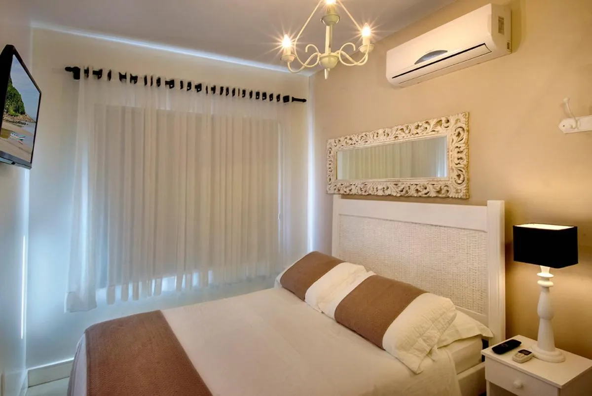 Bed in Pousada Bora Bora