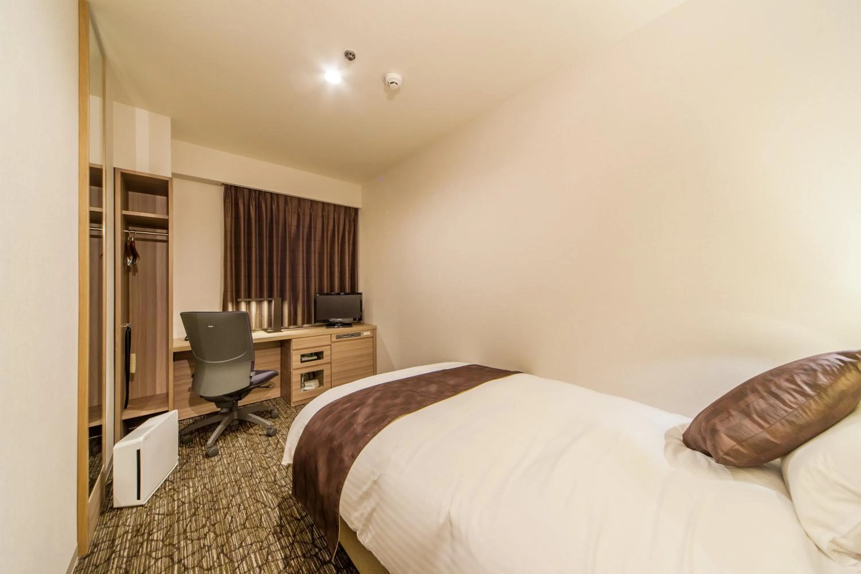 Bed in Hotel Fukuoka Garden Palace