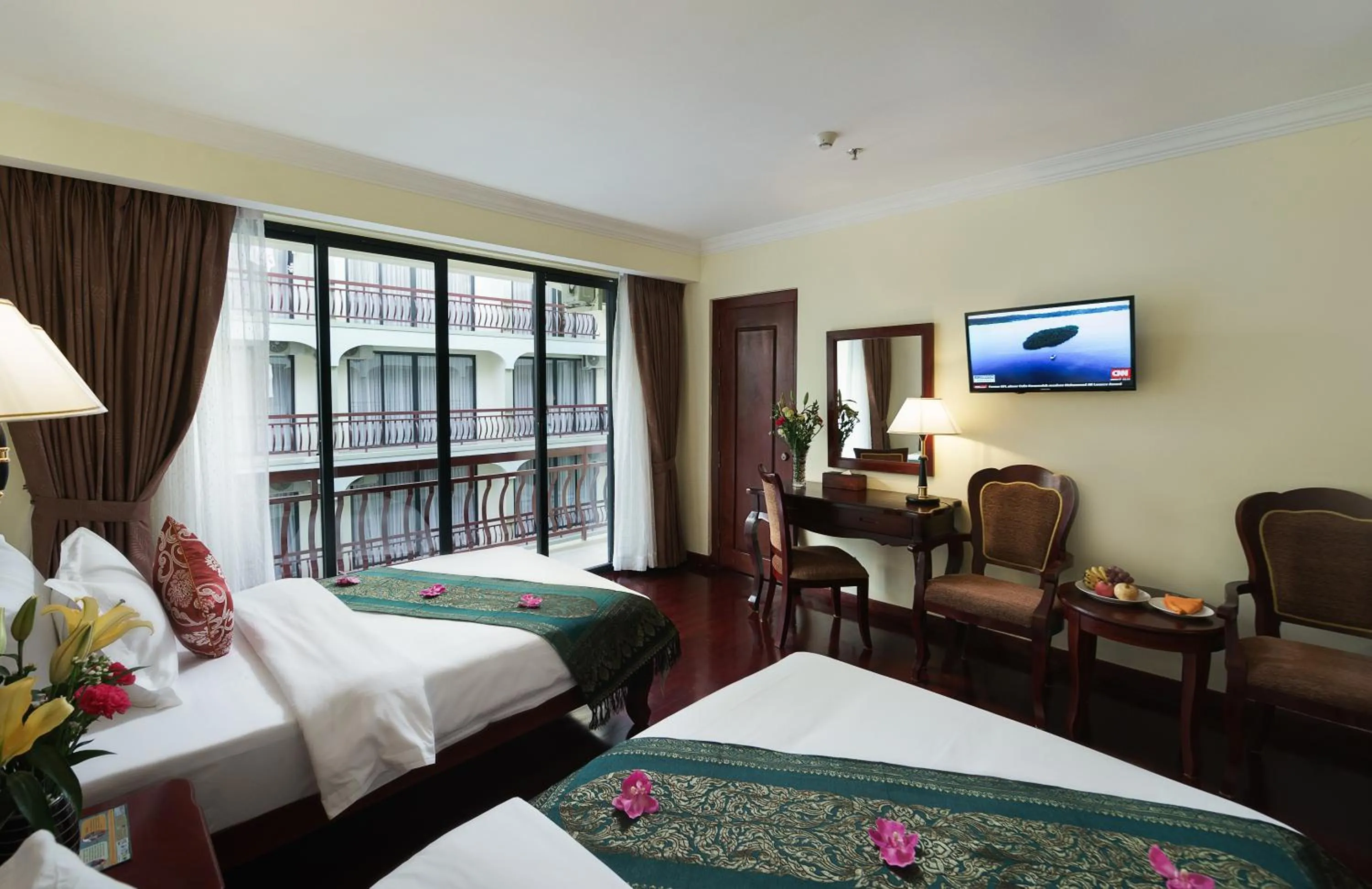 Bed in Smiling Deluxe Hotel