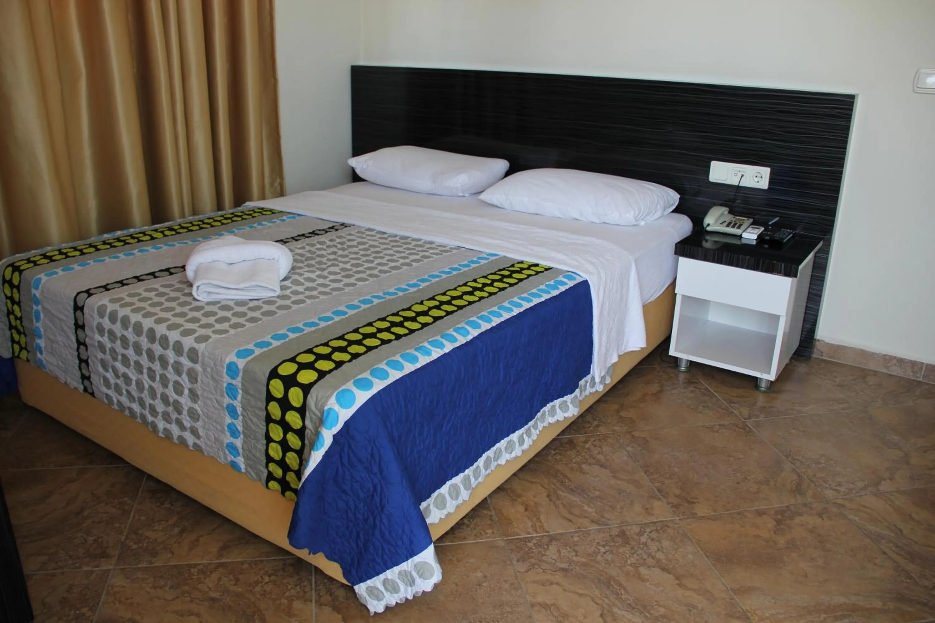 Bed in Le Moral Apart Hotel