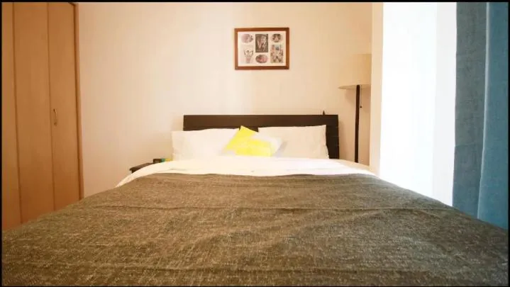 Bed in Uhome Kanda Hotel