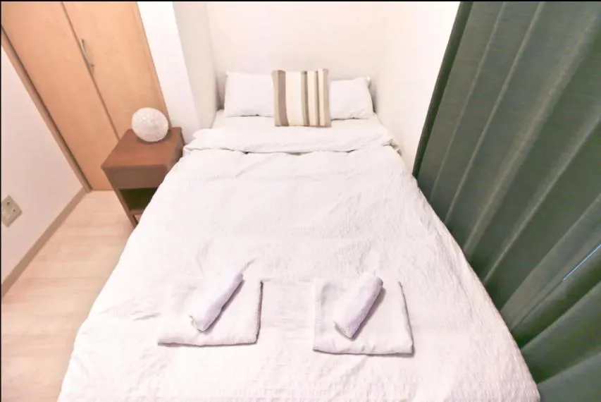 Bed in Uhome Kanda Hotel