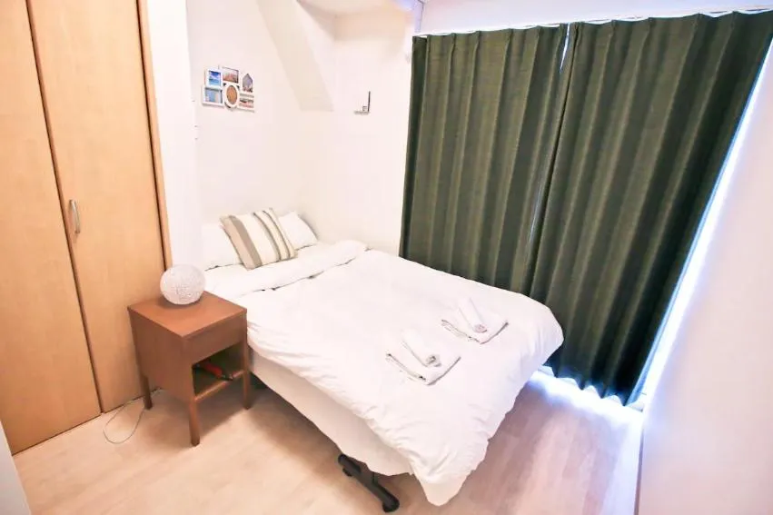 Bed in Uhome Kanda Hotel