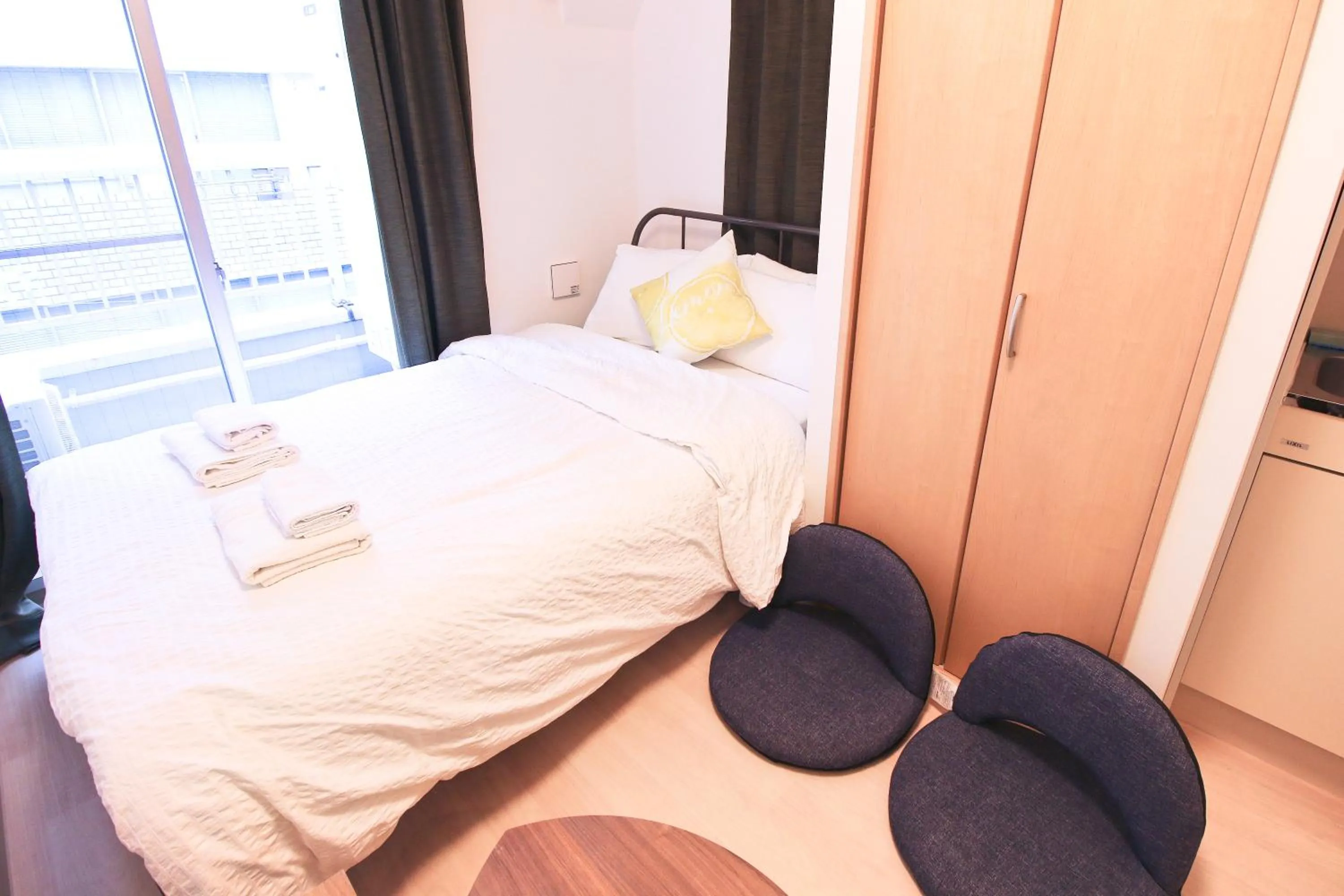 Bed in Uhome Kanda Hotel