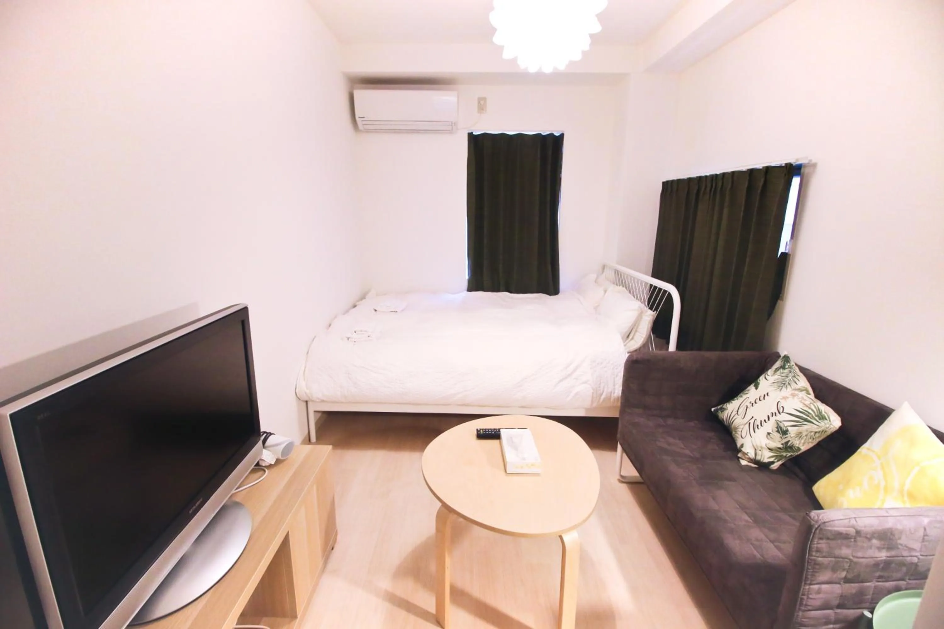 Bed in Uhome Kanda Hotel