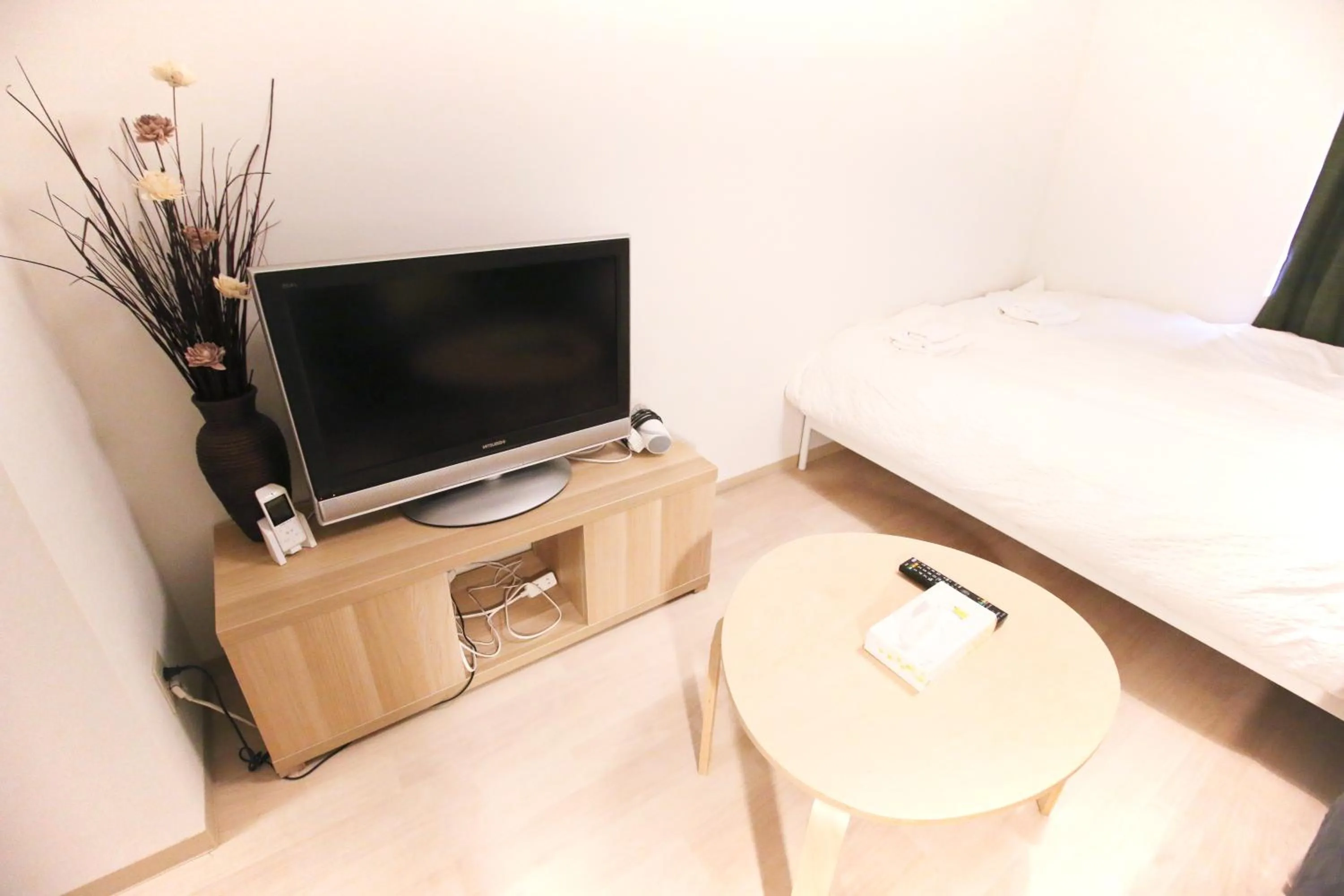 Bed in Uhome Kanda Hotel