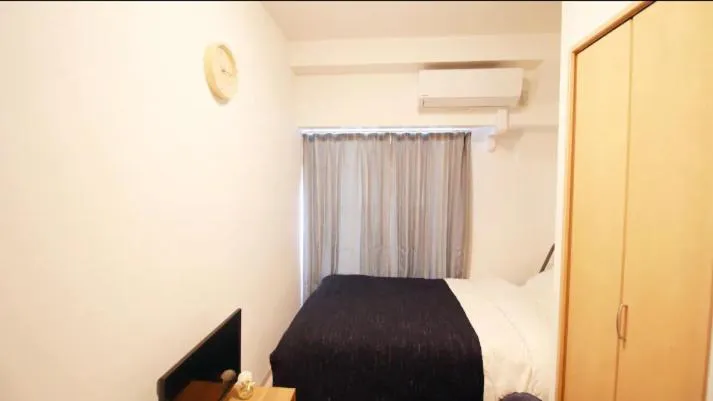 Bed in Uhome Kanda Hotel