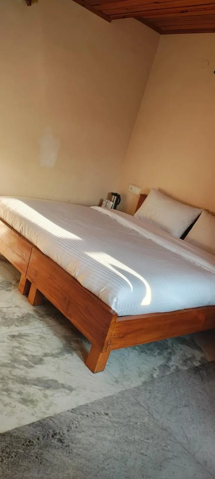 Bed in Hotel Atul Regency