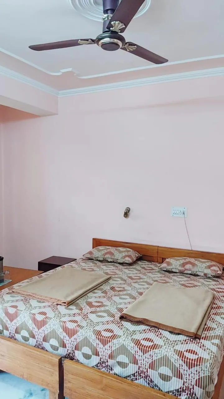 Bed in Hotel Atul Regency