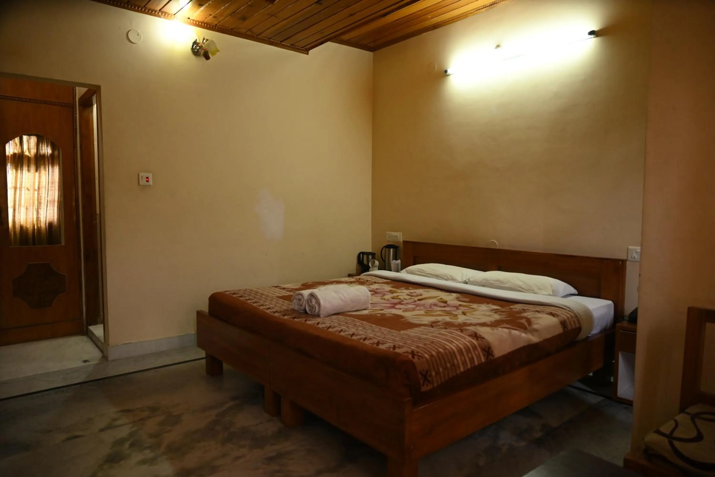 Bed in Hotel Atul Regency