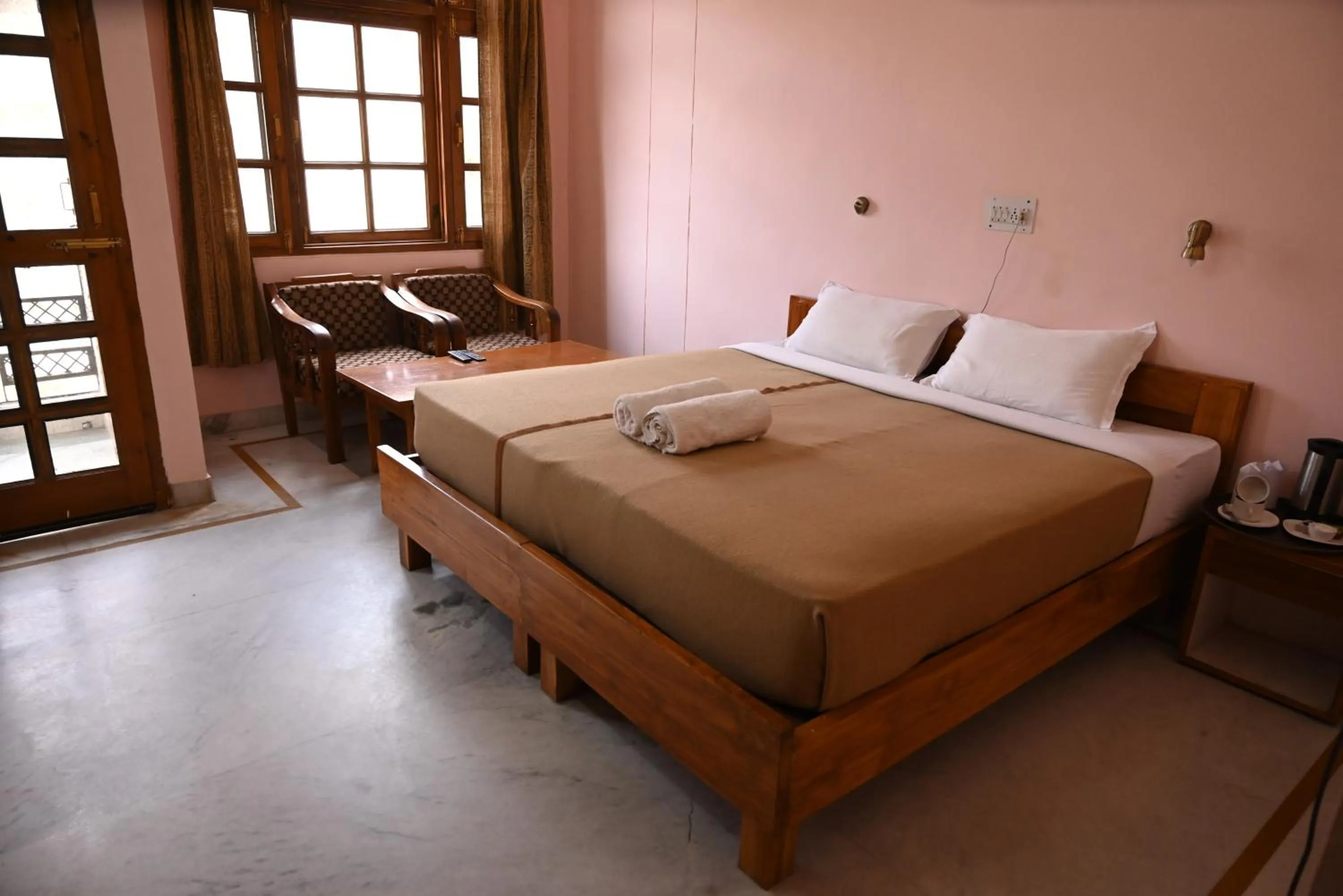 Bed in Hotel Atul Regency