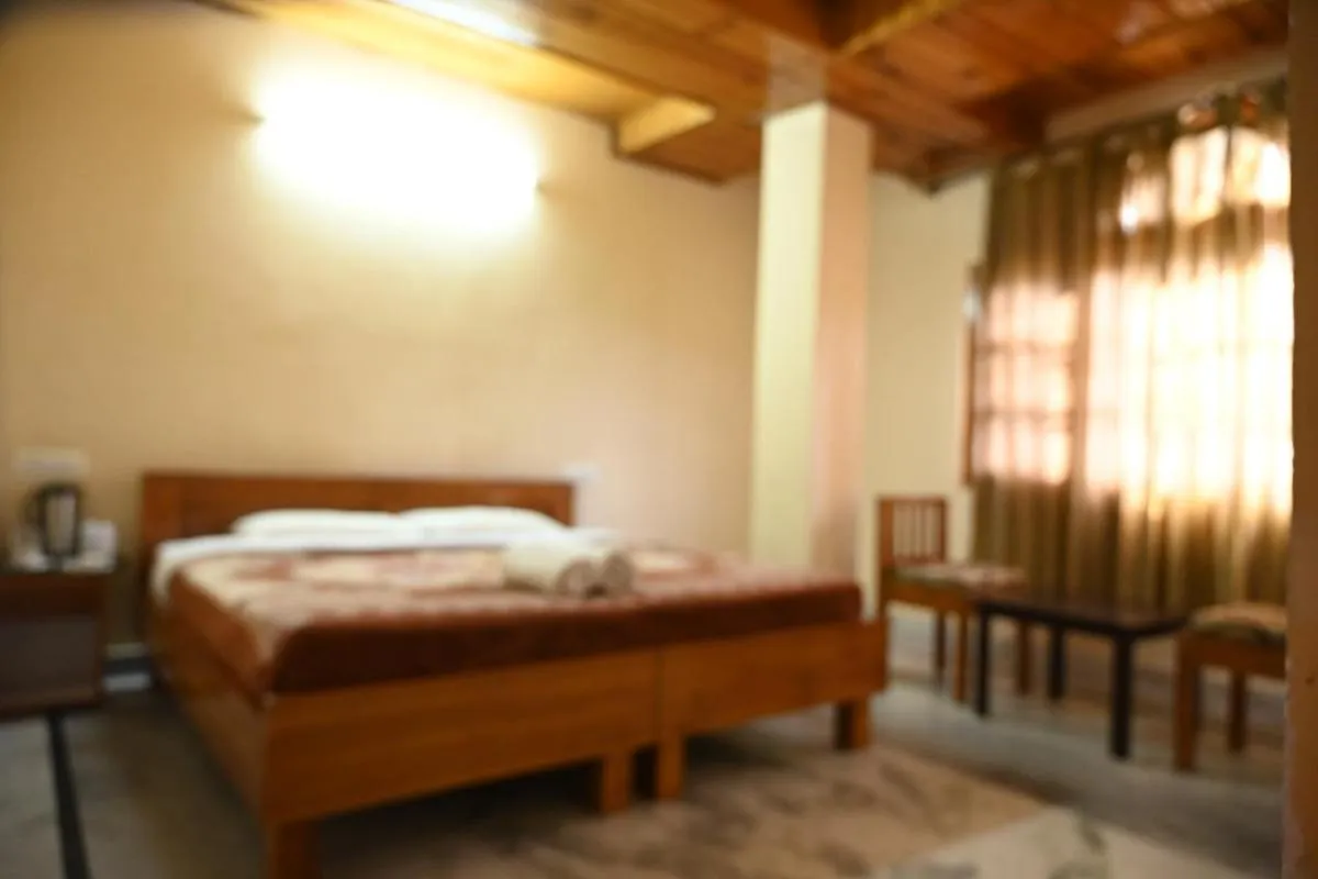 Bed in Hotel Atul Regency