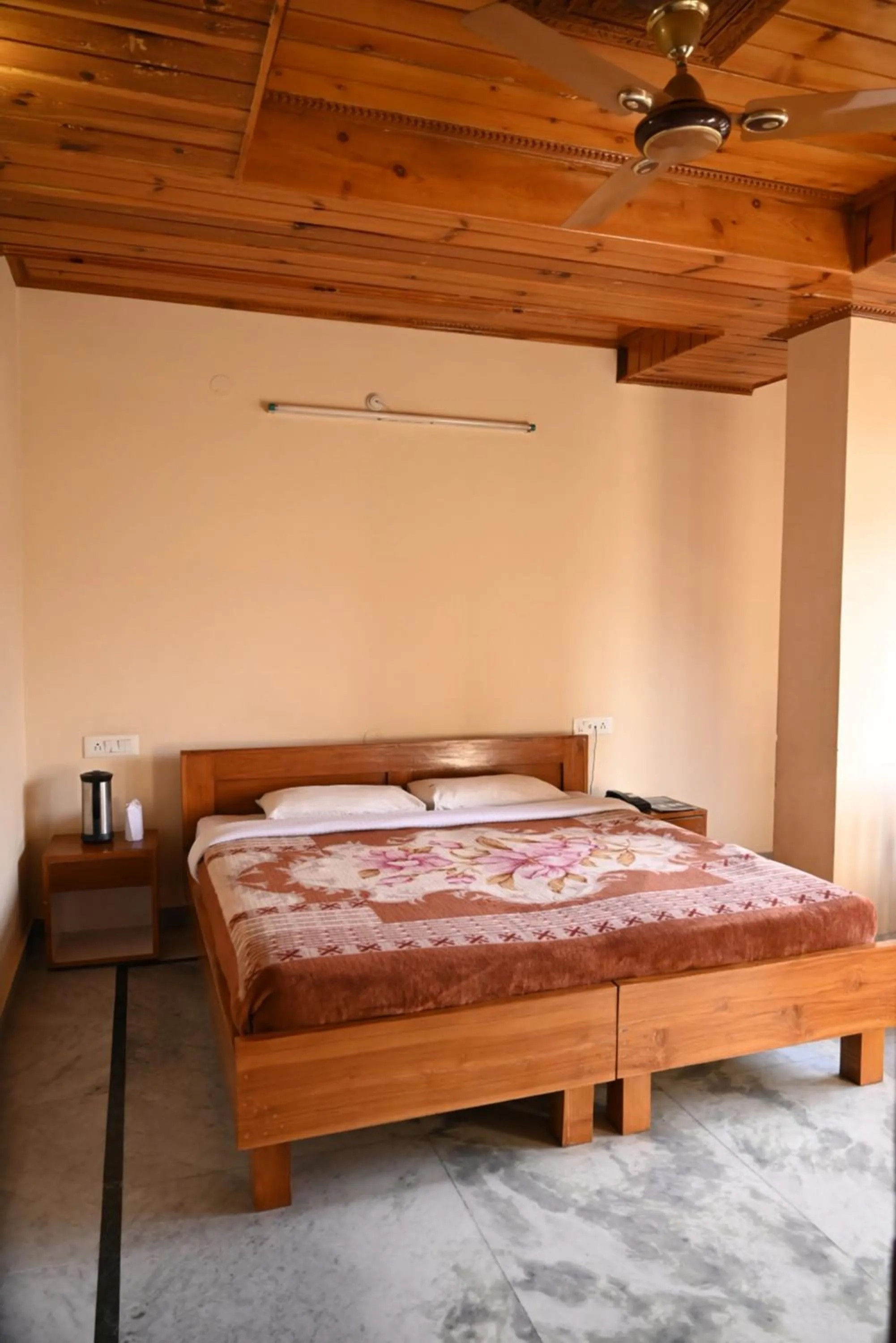 Bed in Hotel Atul Regency